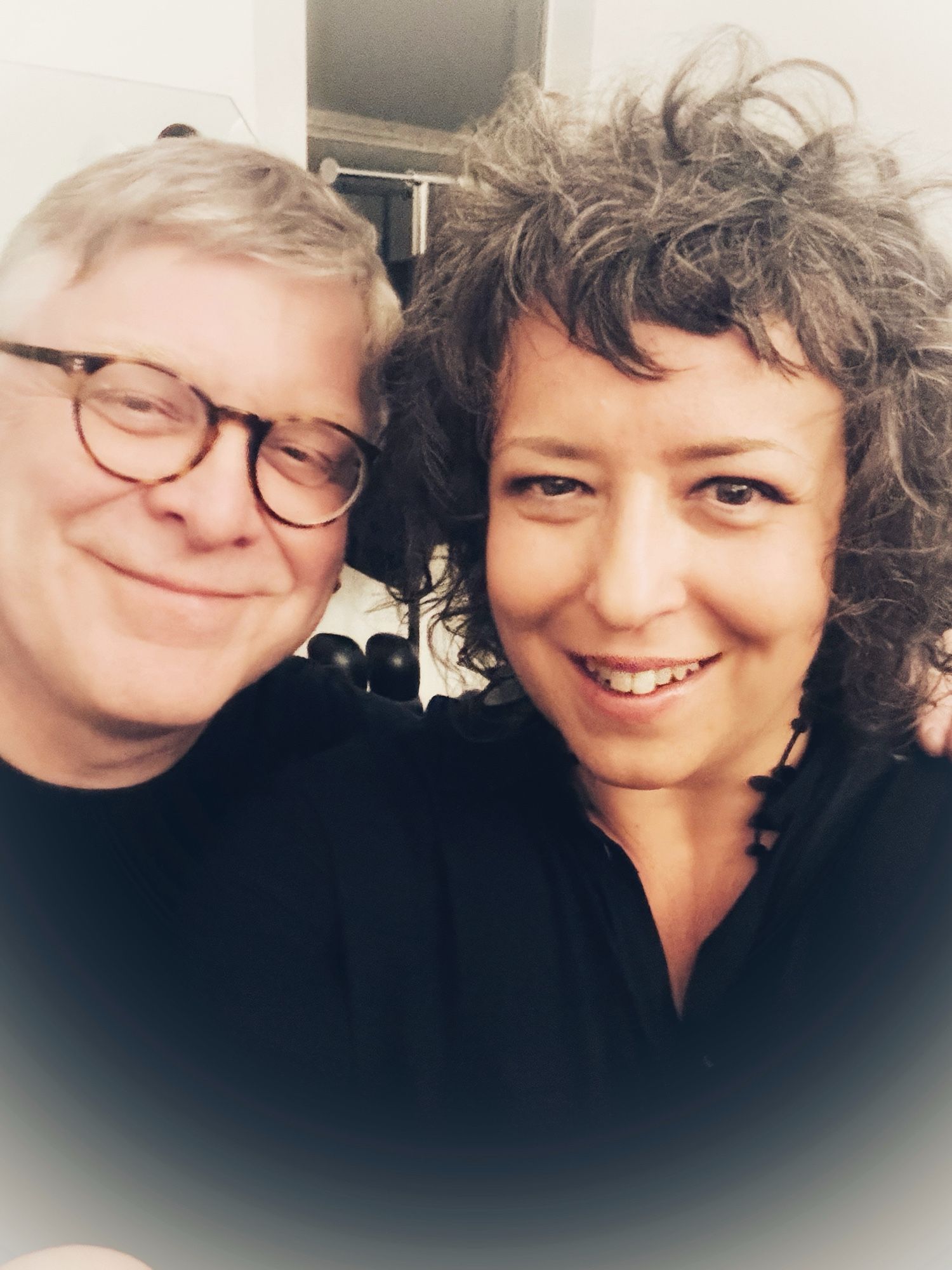 Photo of middle-aged Caucasian man and woman smiling in a selfie together.