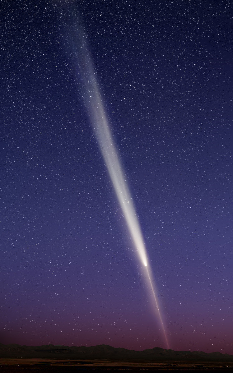 On October 14 it was hard to capture a full view of Comet C/2023 A3 Tsuchinshan-ATLAS. Taken after the comet's closest approach to our fair planet, this evening skyview almost does though. With two telephoto frames combined, the image stretches about 26 degrees across the sky from top to bottom, looking west from Gates Pass, Tucson, Arizona. Comet watchers that night could even identify globular star cluster M5 and the faint apparition of periodic comet 13P Olbers near the long the path of Tsuchinshan-ATLAS's whitish dust tail above the bright comet's coma. Due to perspective as the Earth is crossing the comet's orbital plane, Tsuchinshan-ATLAS also has a pronounced antitail. The antitail is composed of dust previously released and fanning out away from the Sun along the comet's orbit, visible as a needle-like extension below the bright coma toward the rugged western horizon.   Growing Gallery: Comet Tsuchinshan-ATLAS in 2024