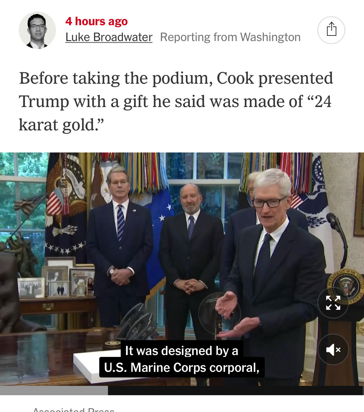 Before taking the podium, Cook presented Trump with a gift he said was made of "24 karat gold."