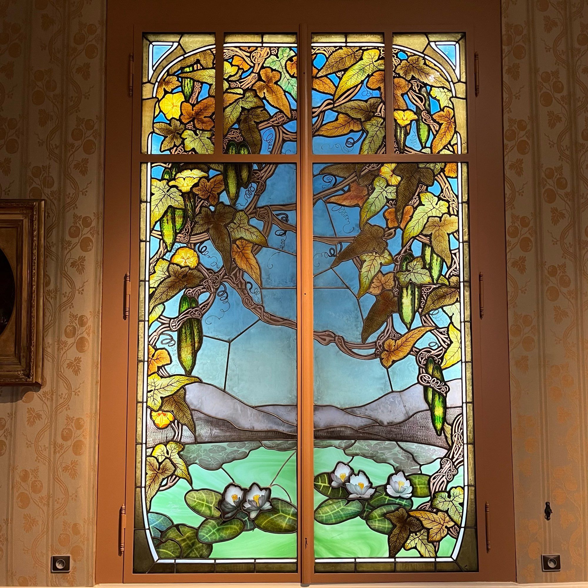 A stained glass window by Jacques Gruber, with gourd and waterlily motifs