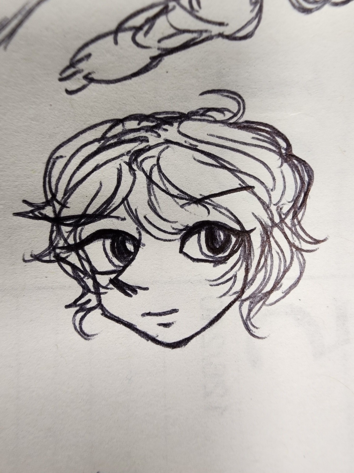 Doodle of a face with big eyes and whispy hair