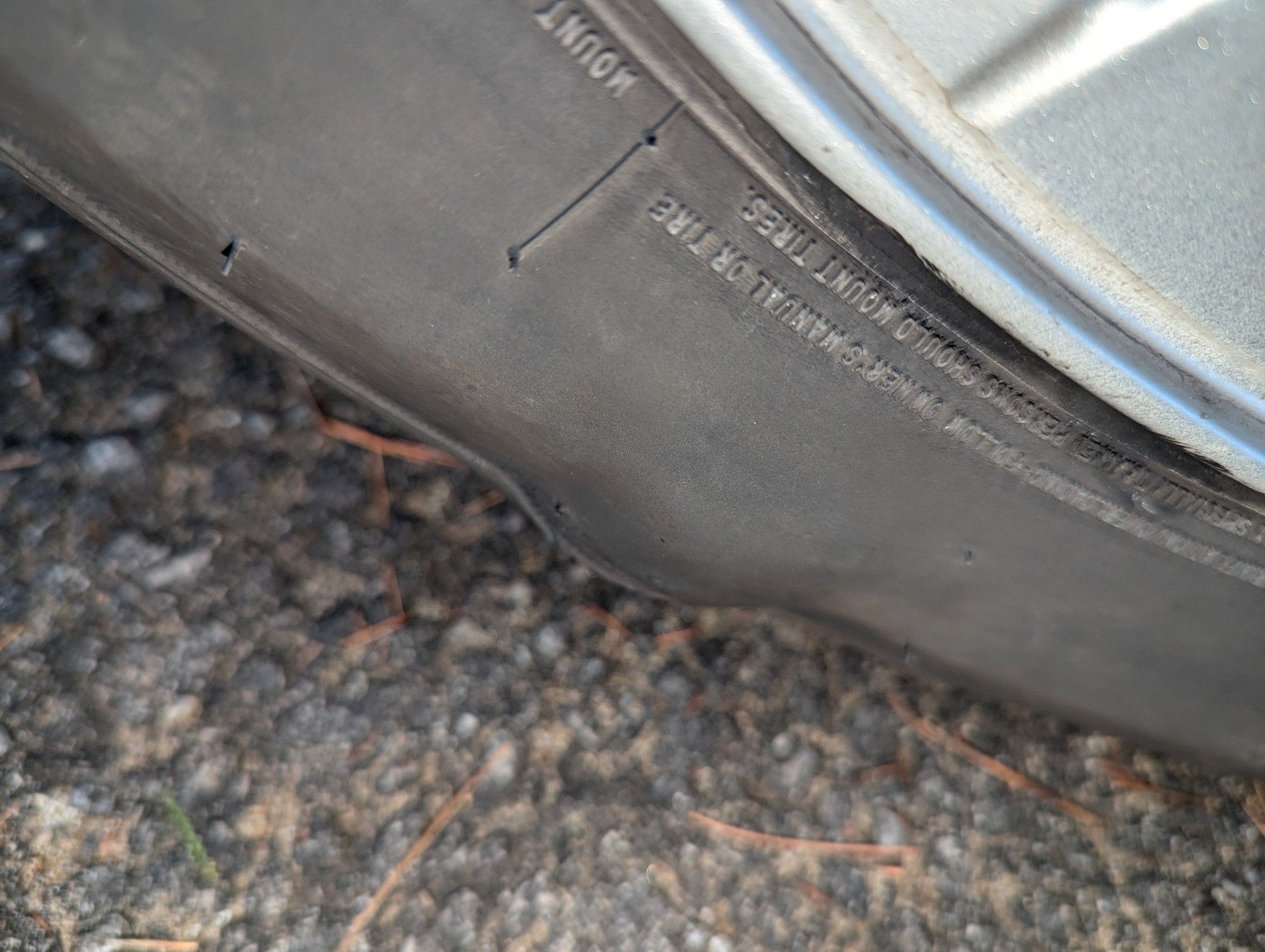 front passenger side tire, with a golf ball sized bulge