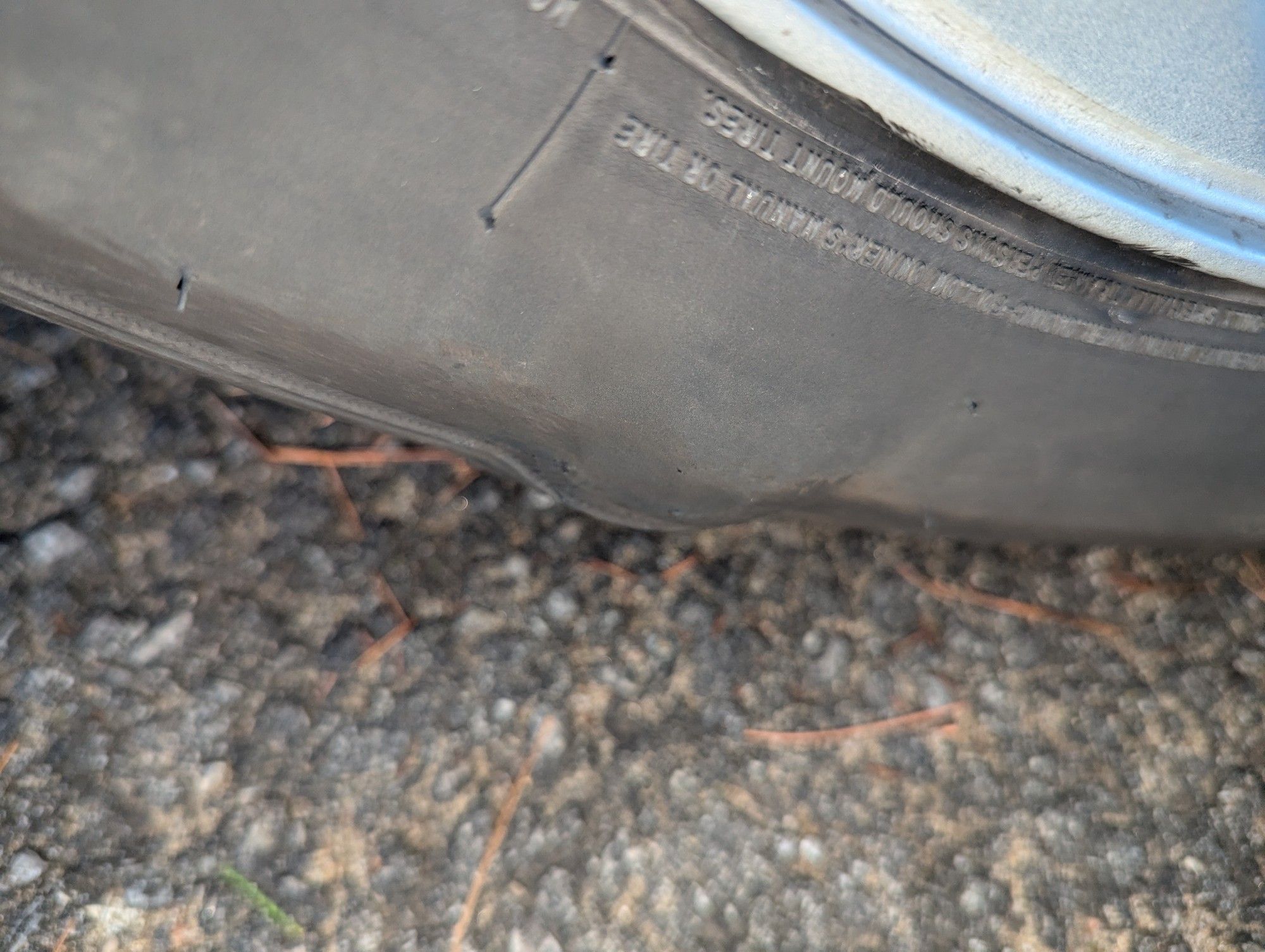 passenger side tire with a golfball sized bulge