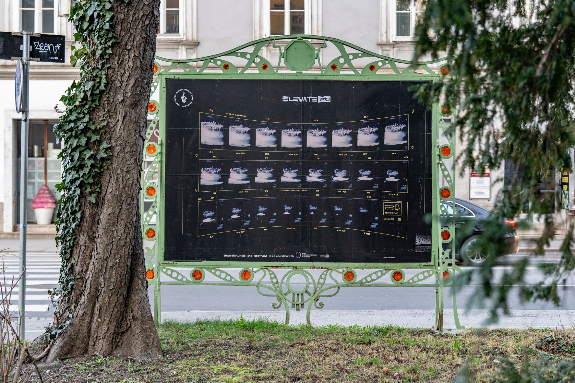 Selected film stills from Sebastian Brauneis' festival film are presented on historical city map panels in public urban space.