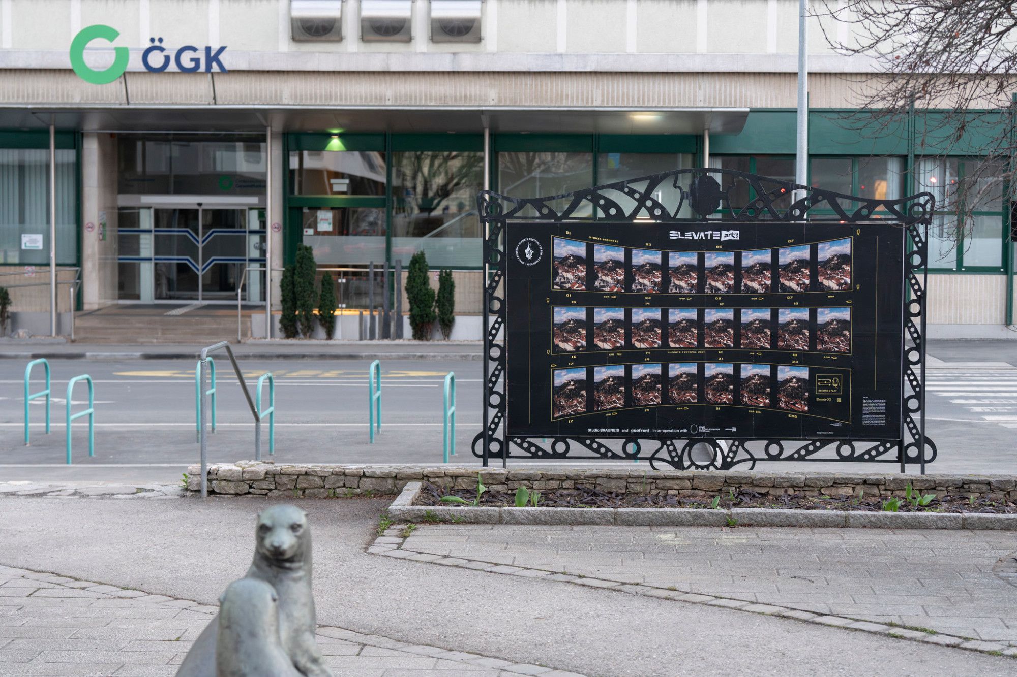 Selected film stills from Sebastian Brauneis' festival film are presented on historical city map panels in public urban space.