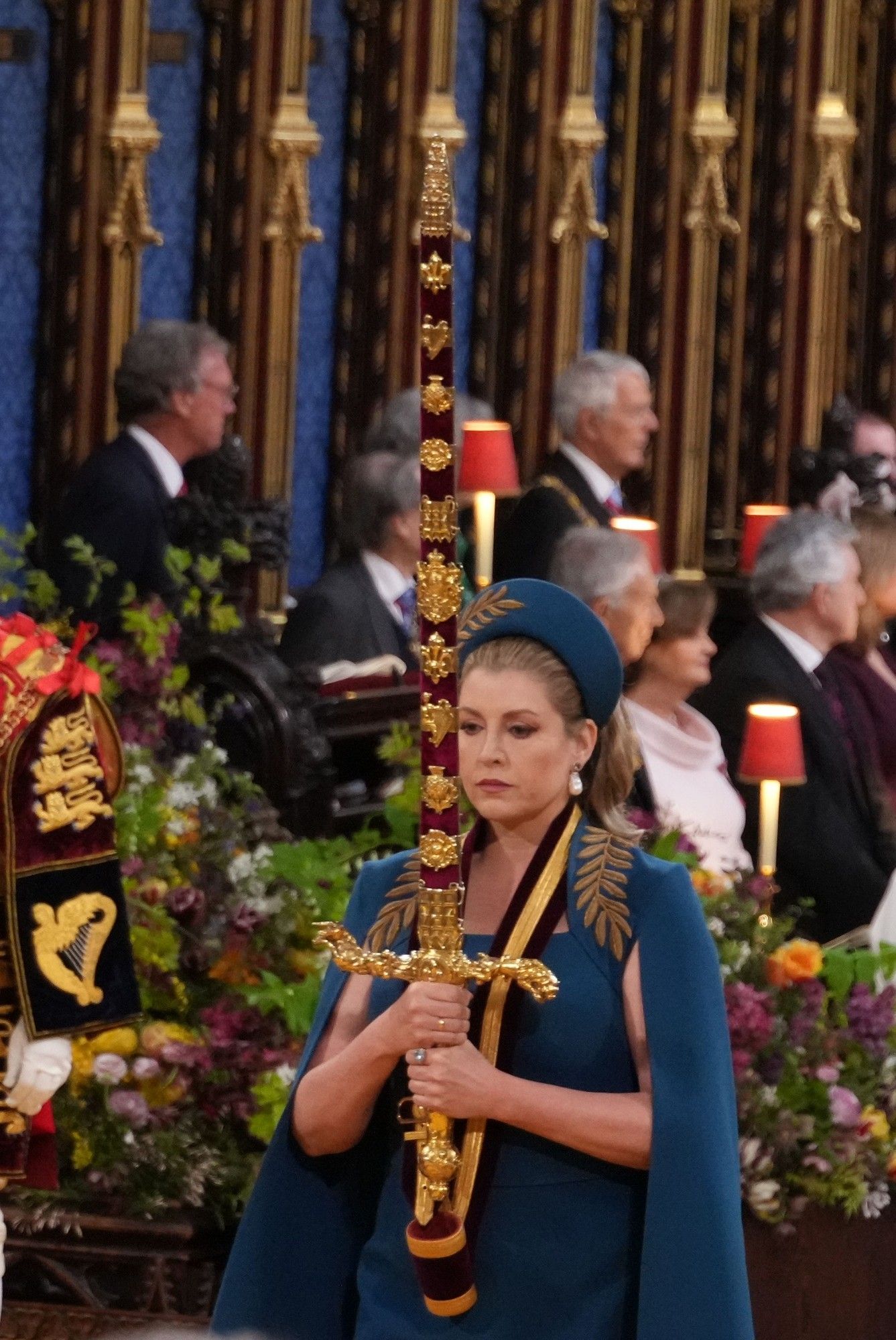 Penny Mordaunt lugging her sword around at coronation of Charles III