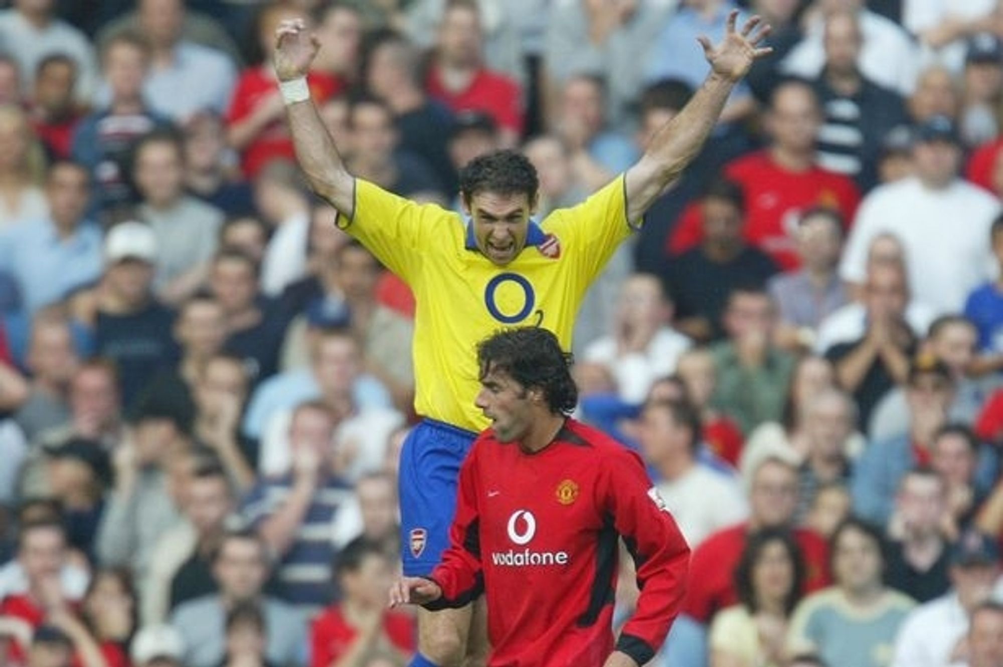 Martin Keown intimidating Ruud Van Nistelrooy after RVN had missed a penalty. Keown has jumped high in the air in RVN's personal space and is screaming down at him as RVN flinches.