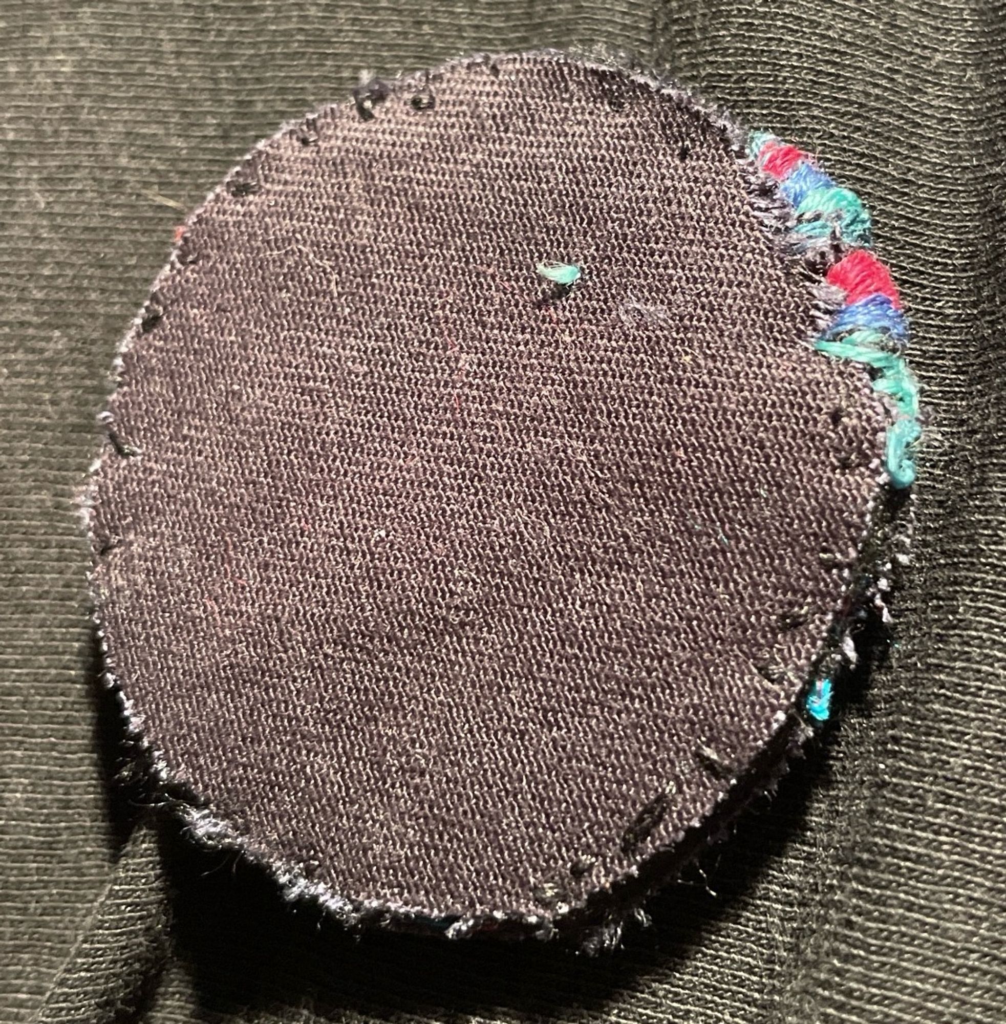 Back of WIP showing a tiny bit of sloppy edging because it’s been years since I made pins.