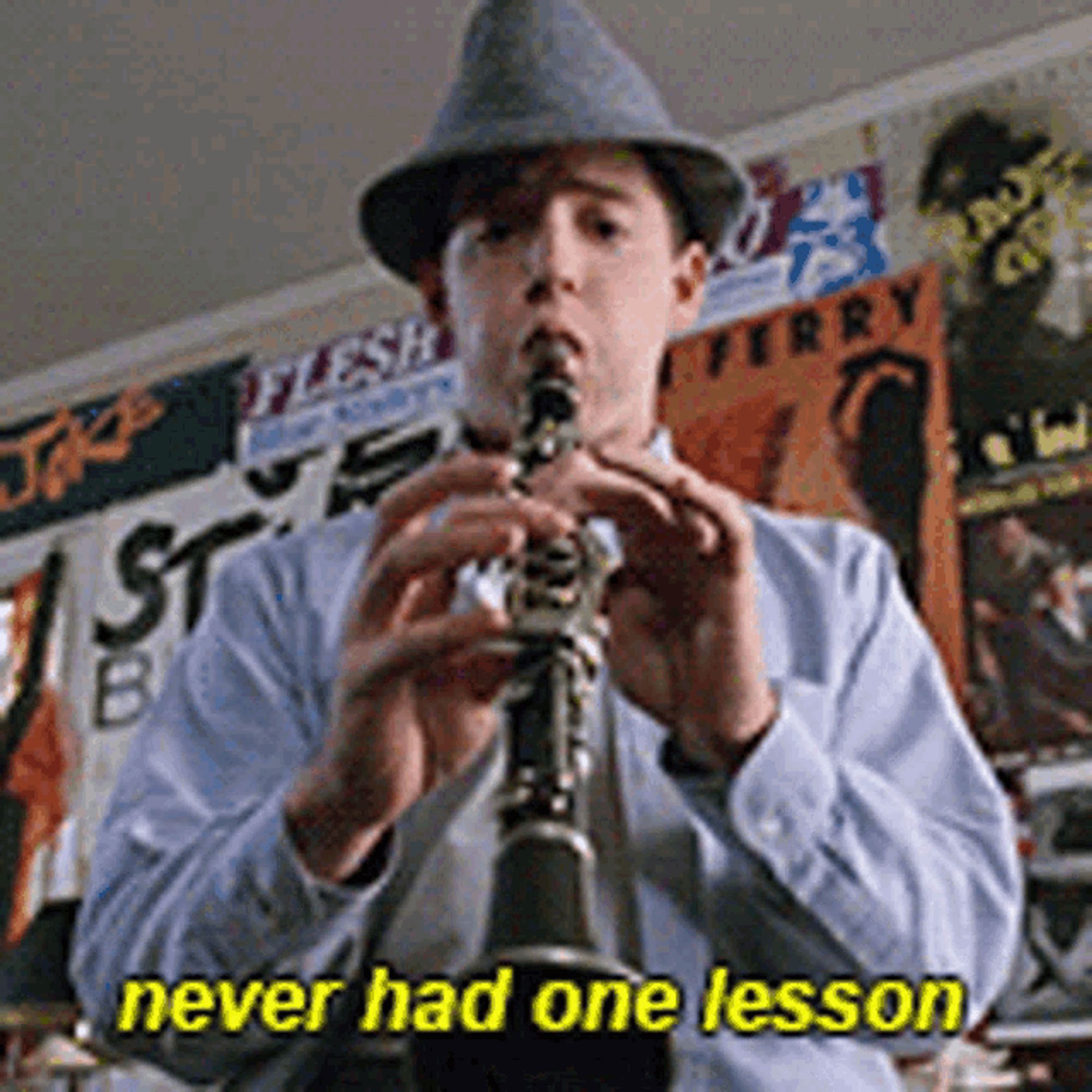 Ferris Bueller, wearing a hat and playing a clarinet. Text under the image reads "never had one lesson"