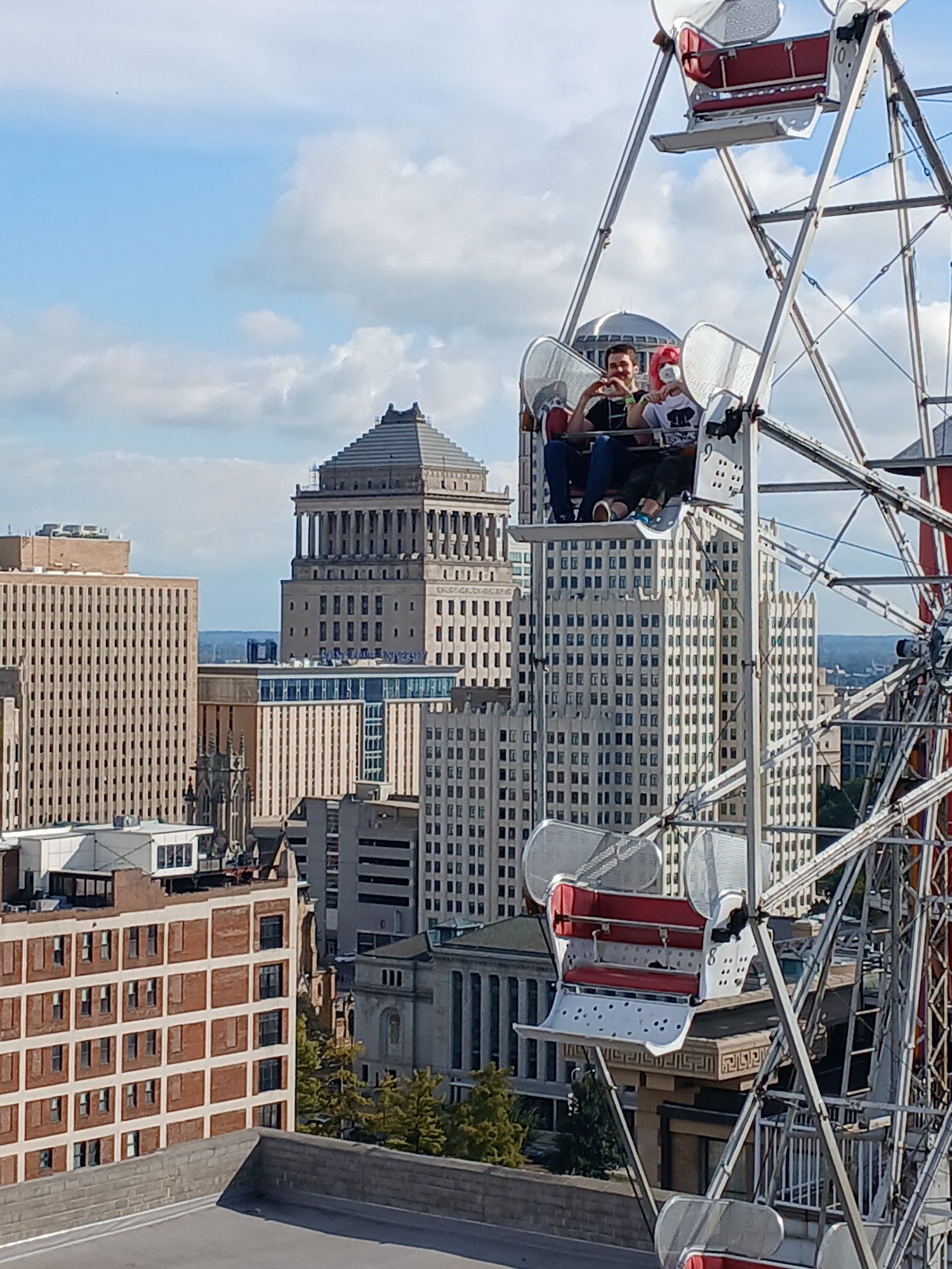 two people riding the rooftop ferris wheel at the city museum in St. Louis, Missouri