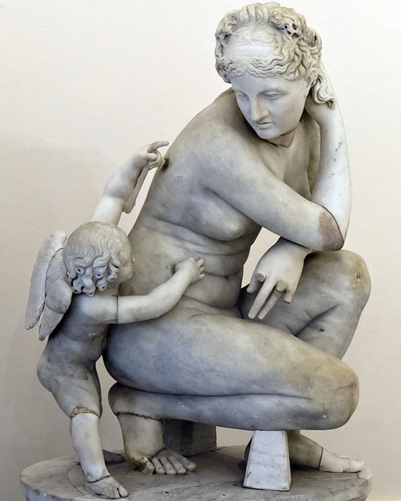 Sculpture of Aphrodite in a crouching position with Eros, Naples National Archaeological Museum