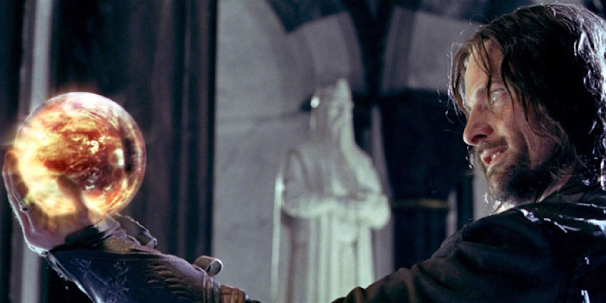 Aragorn from the Lord of the Rings gazing (lovingly?) into a Palantir showing the eye of Sauron.