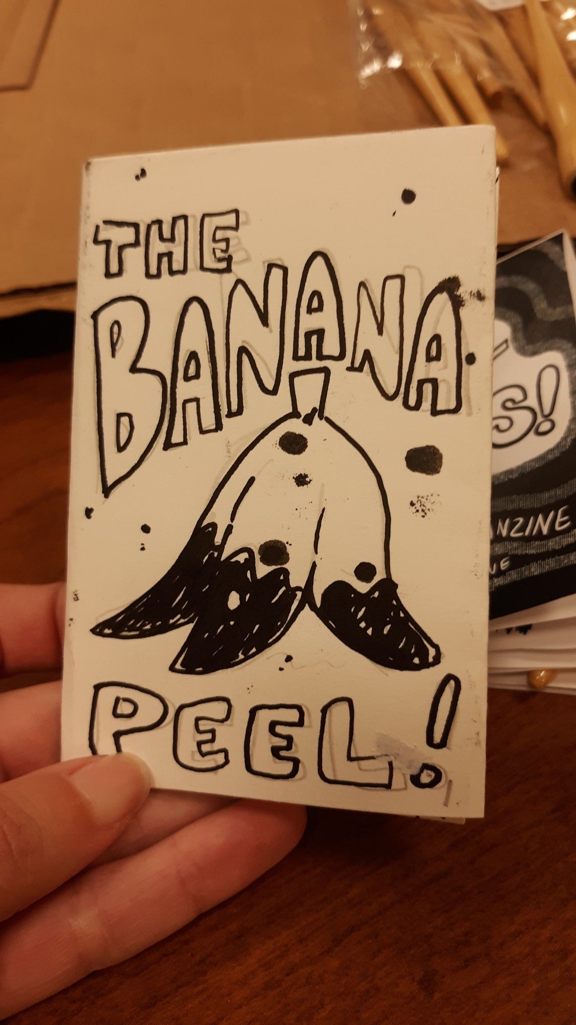 photograph of a traditional zine cover. Text reads: The Banana Peel! around a drawing of a banana peel