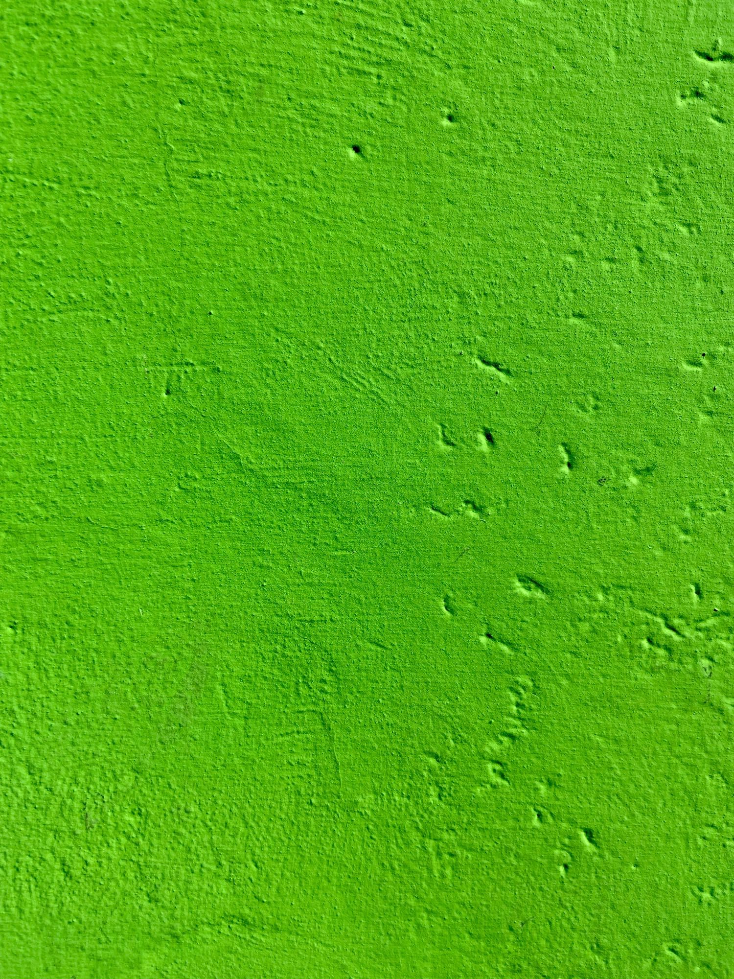 Photo d'un mur vert pomme.