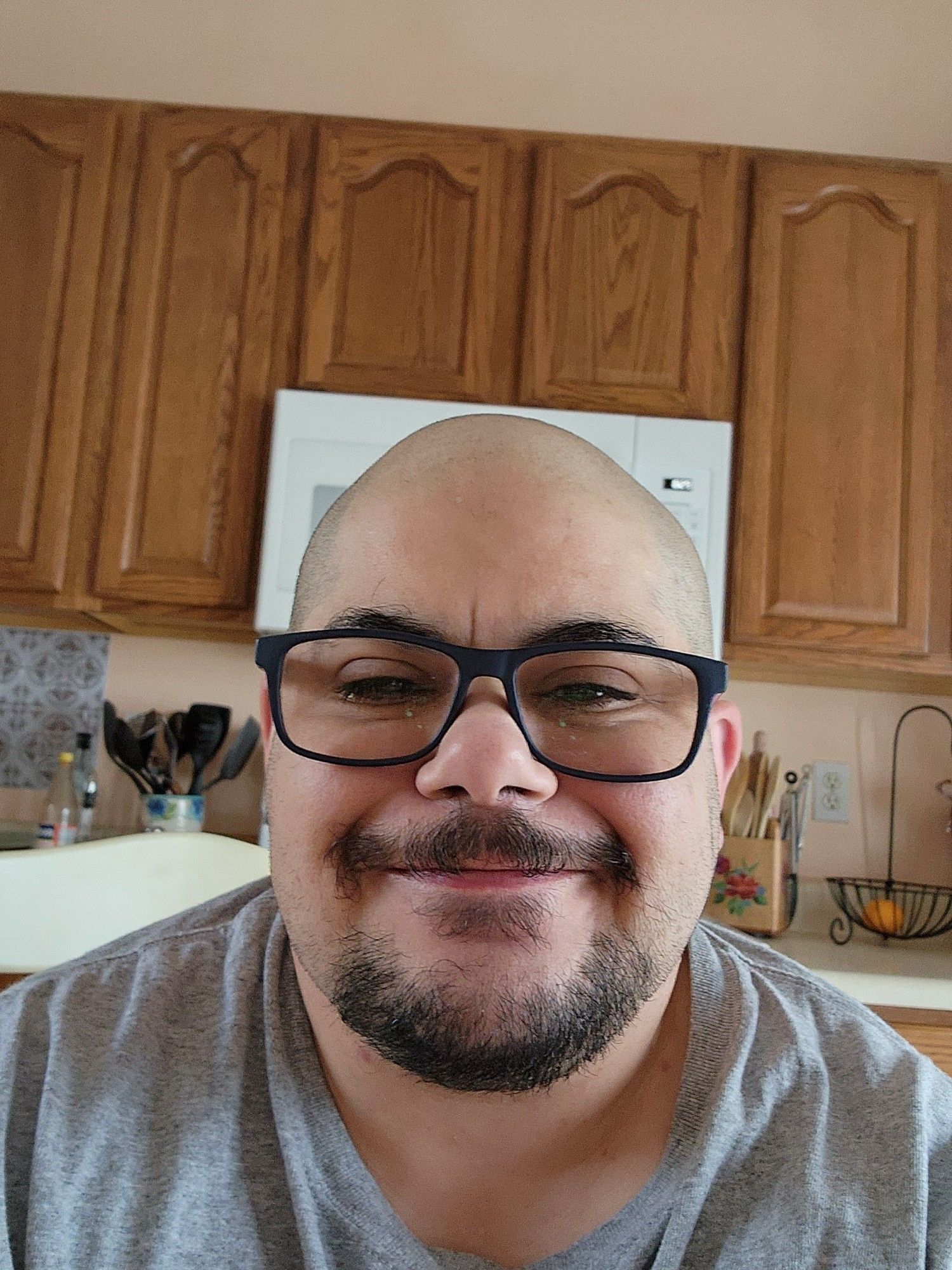 Bald man with glasses