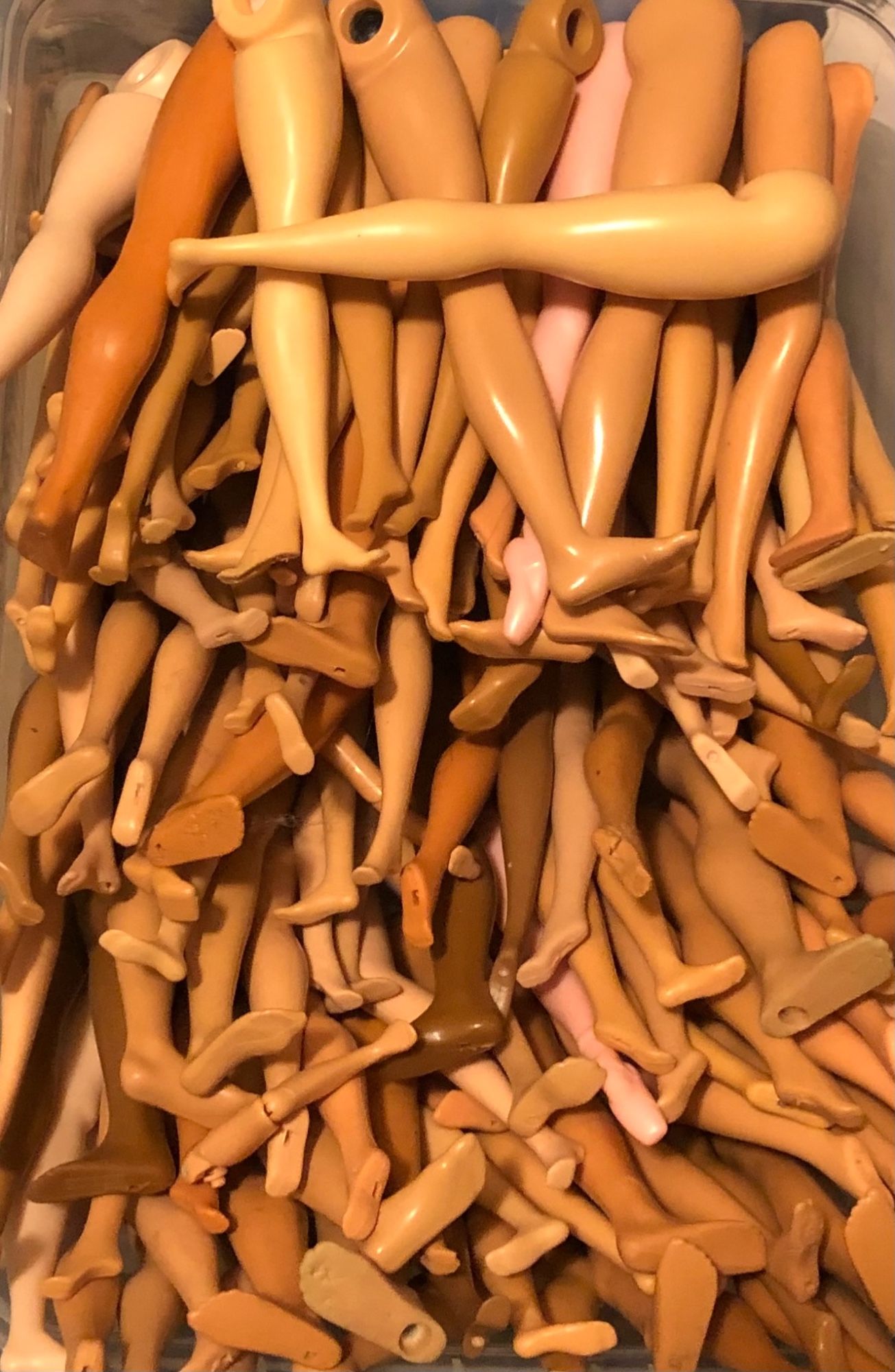 Barbie and ken type legs in a variety of skin tones