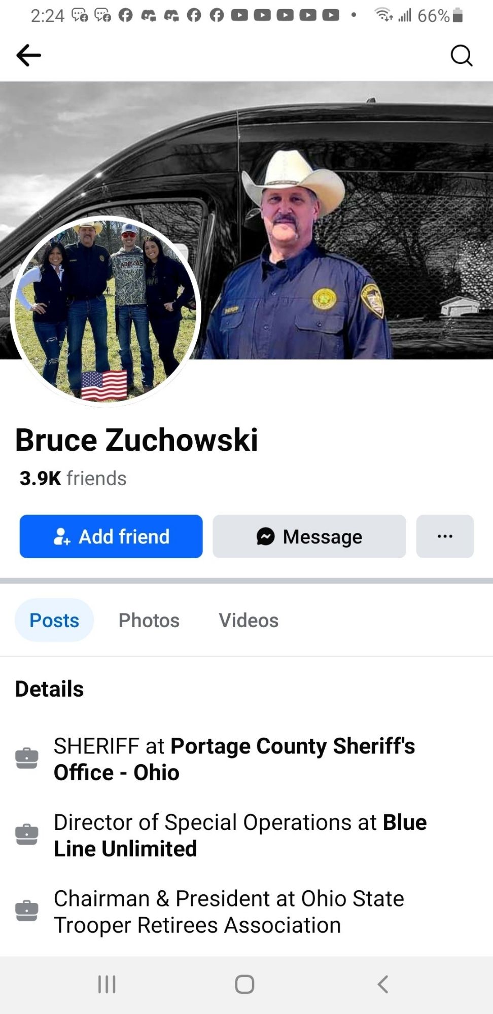 His profile page showing that he's the sheriff of portage county. He's a white dude with a white cowboy hat and mustache.