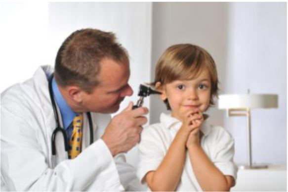 A stock photo of a doctor examining a kid