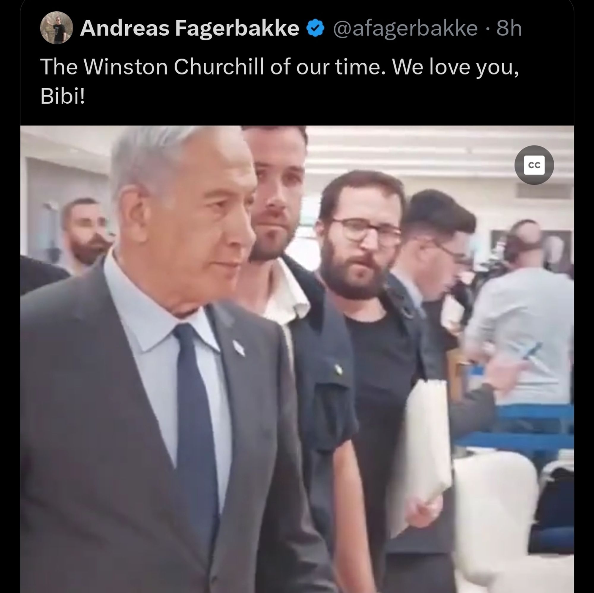 Twitter screenshot from a video of genocidal war criminal Netanyahu. The tweet reads "The Winston Churchill of our time. We love you, Bibi!"