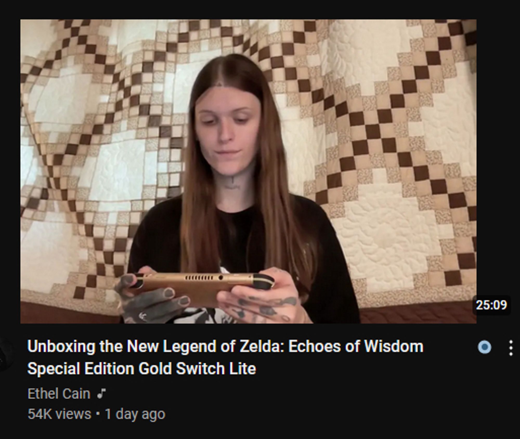 thumbnail of a video from music artist Ethel Cain titled "Unboxing the New Legend of Zelda: Echoes of Wisdom Special Edition Gold Switch Lite"