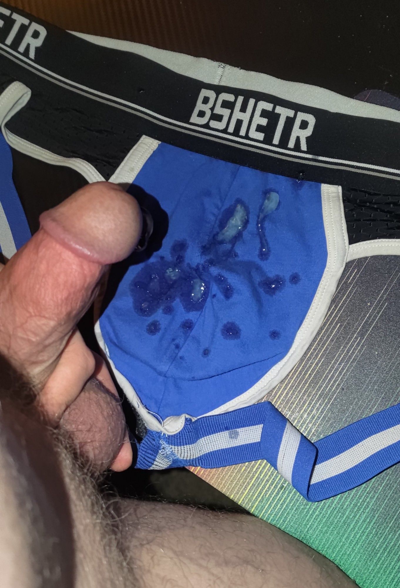 Cumshot on another man's blue jockstrap. We had fucked a few times over the weekend, so this load was thinner because my balls were finally almost empty 