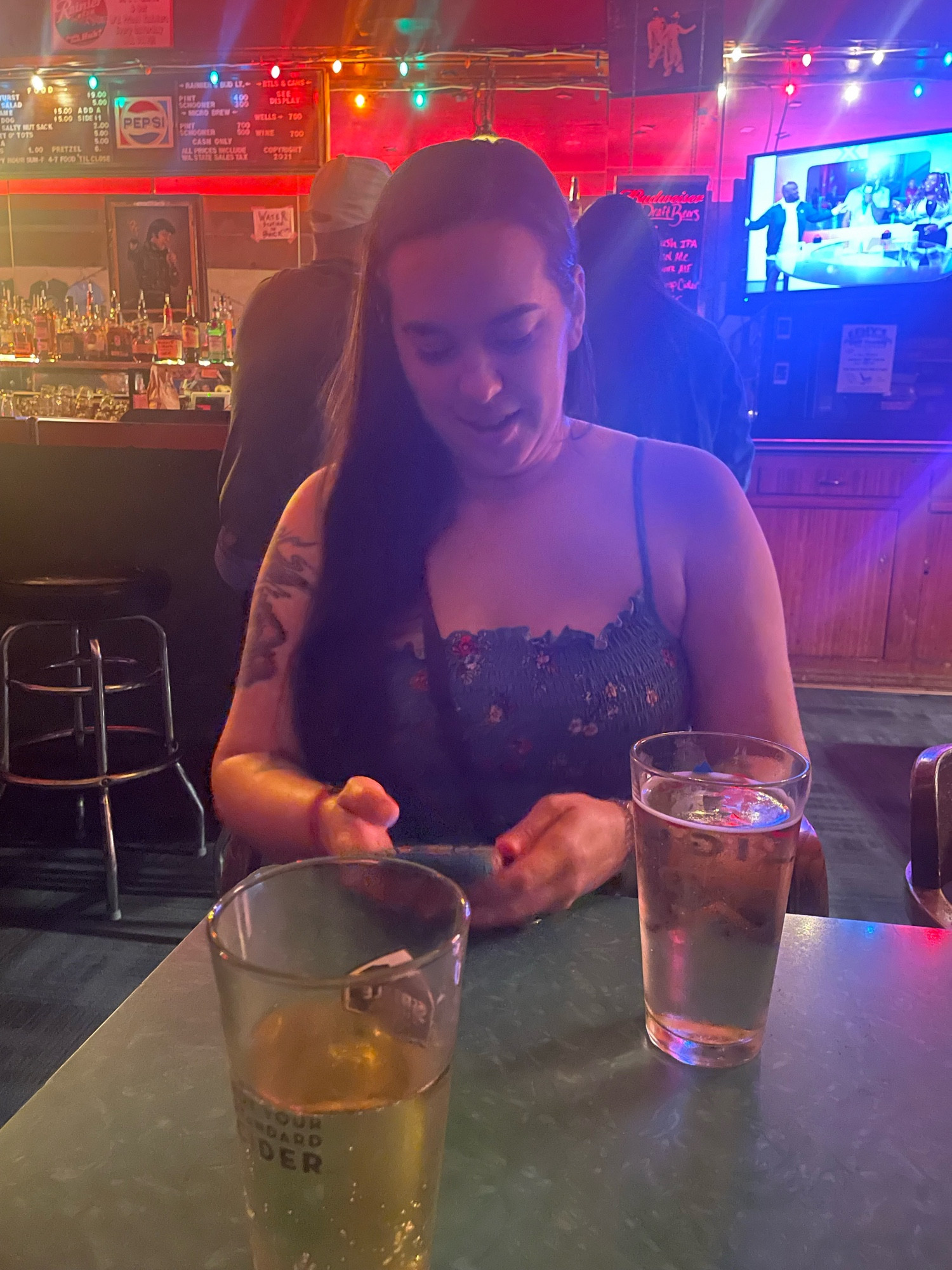 Gennie, my wife, at a birthday party for her daughter, texting her other daughter.