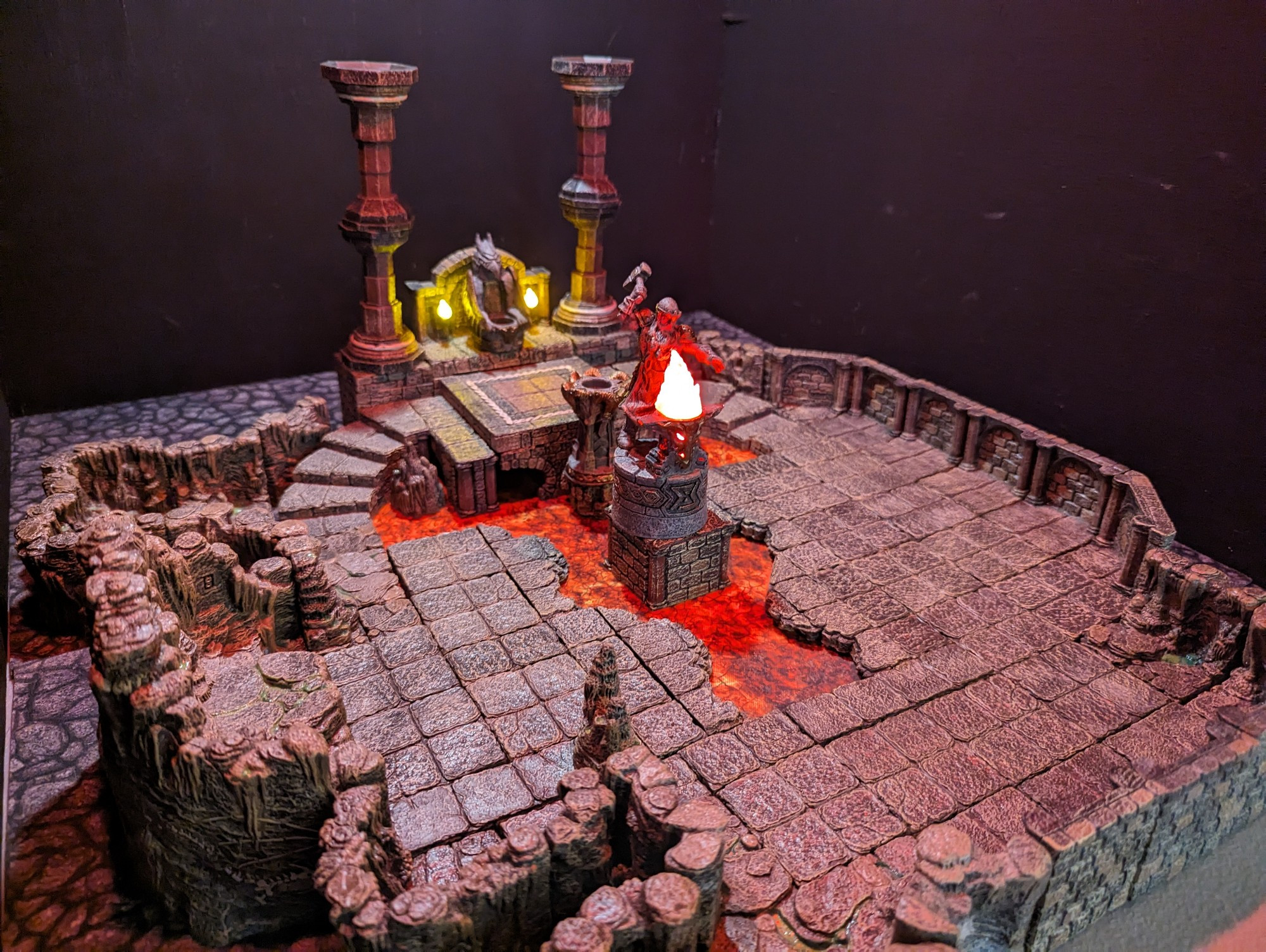 A tabletop miniature set depicting a dungeon with lava.