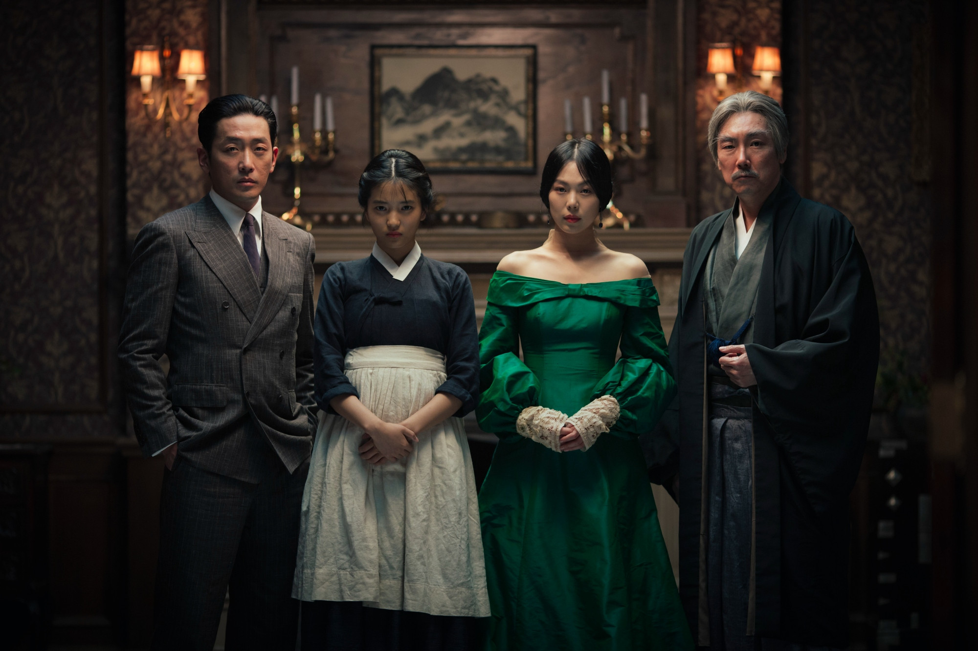 the handmaiden (2016). four people in period japanese and european garb stand in a line in front of a fireplace. 