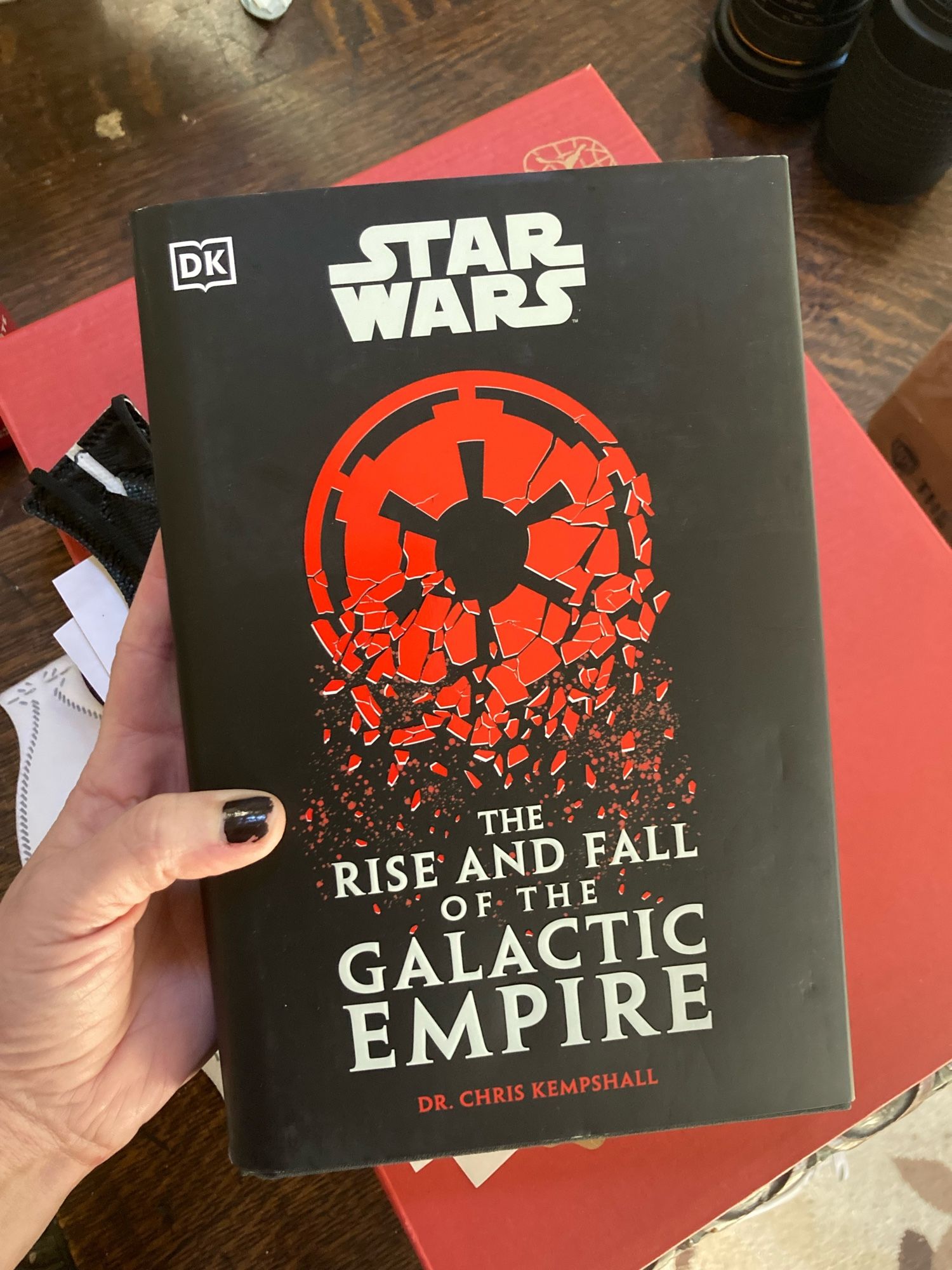 My hand holding Dr. Chris Kempshall’s STAR WARS: THE RISE AND FALL OF THE GALACTIC EMPIRE.