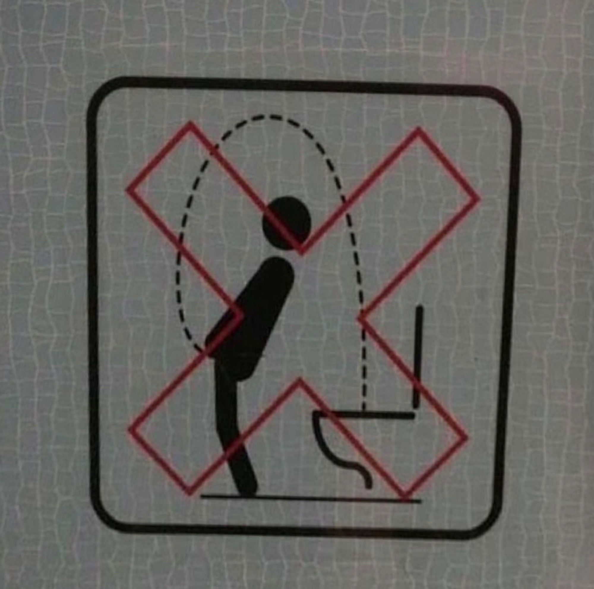 Restroom sign of a man urinating in a convoluted manner