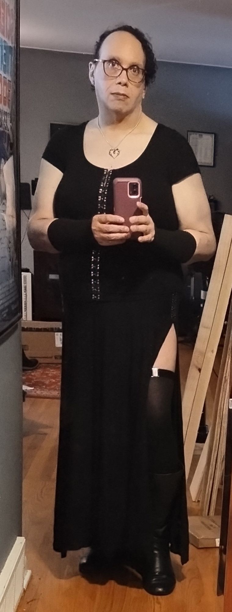 Me as your hot goth mom. Long black skirt with slit showing leg with thigh high socks. Black top with arm warmers.