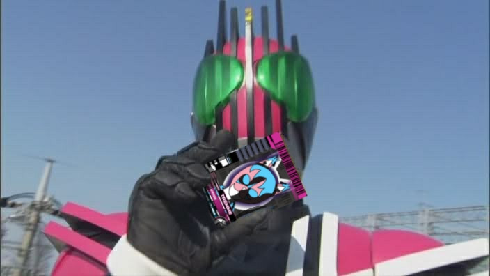 An edit of Kamen Rider Decade holding a Rider Card depicting my original tokusatsu heroine, Link Warrior Tremme