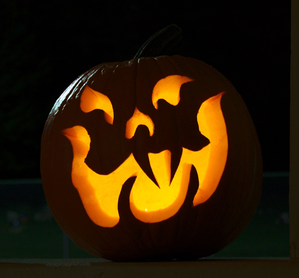 Glowing cat-like face on a pumpkin