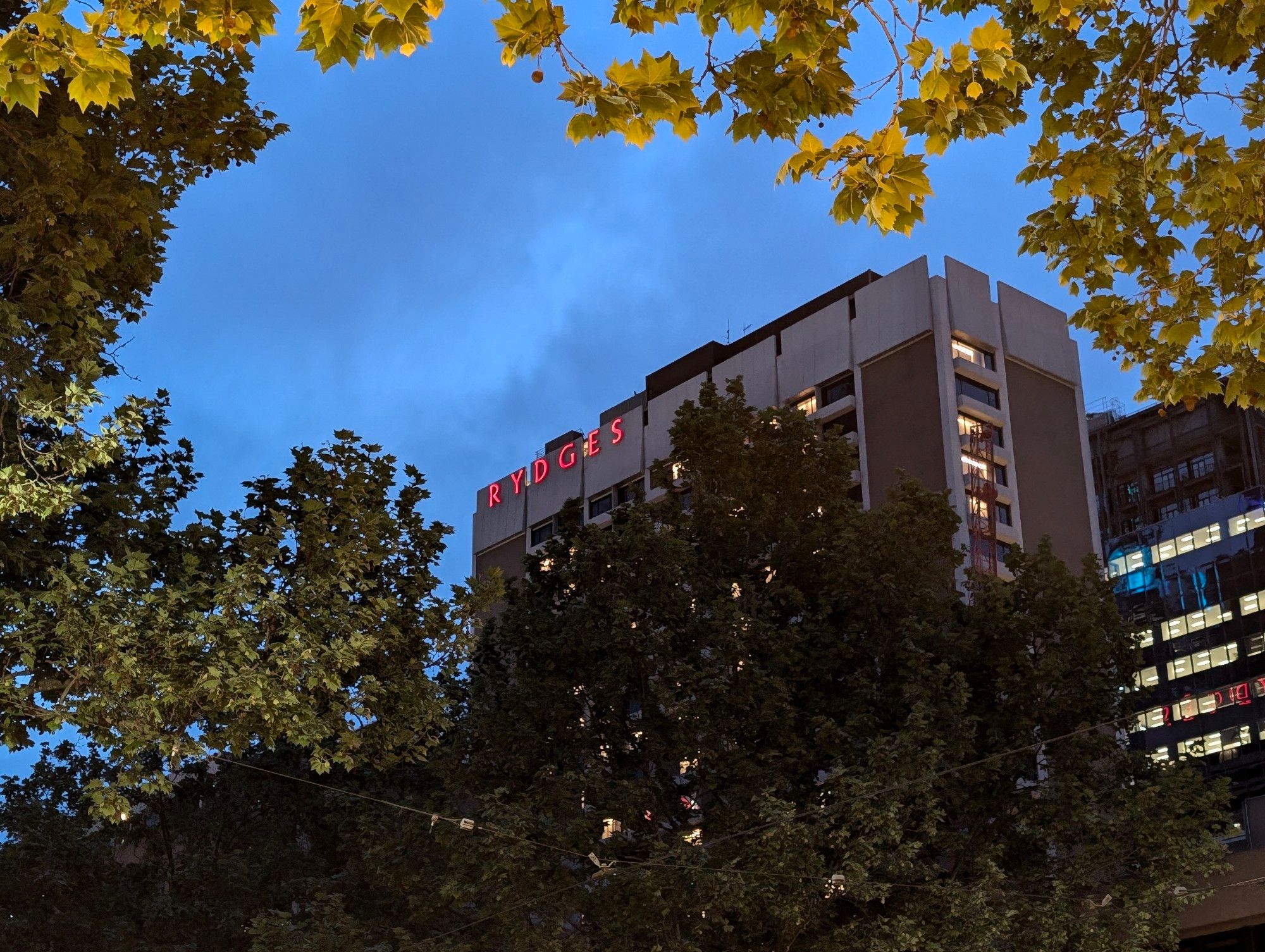 Rydges Melbourne hotel seen from Bourke St at night