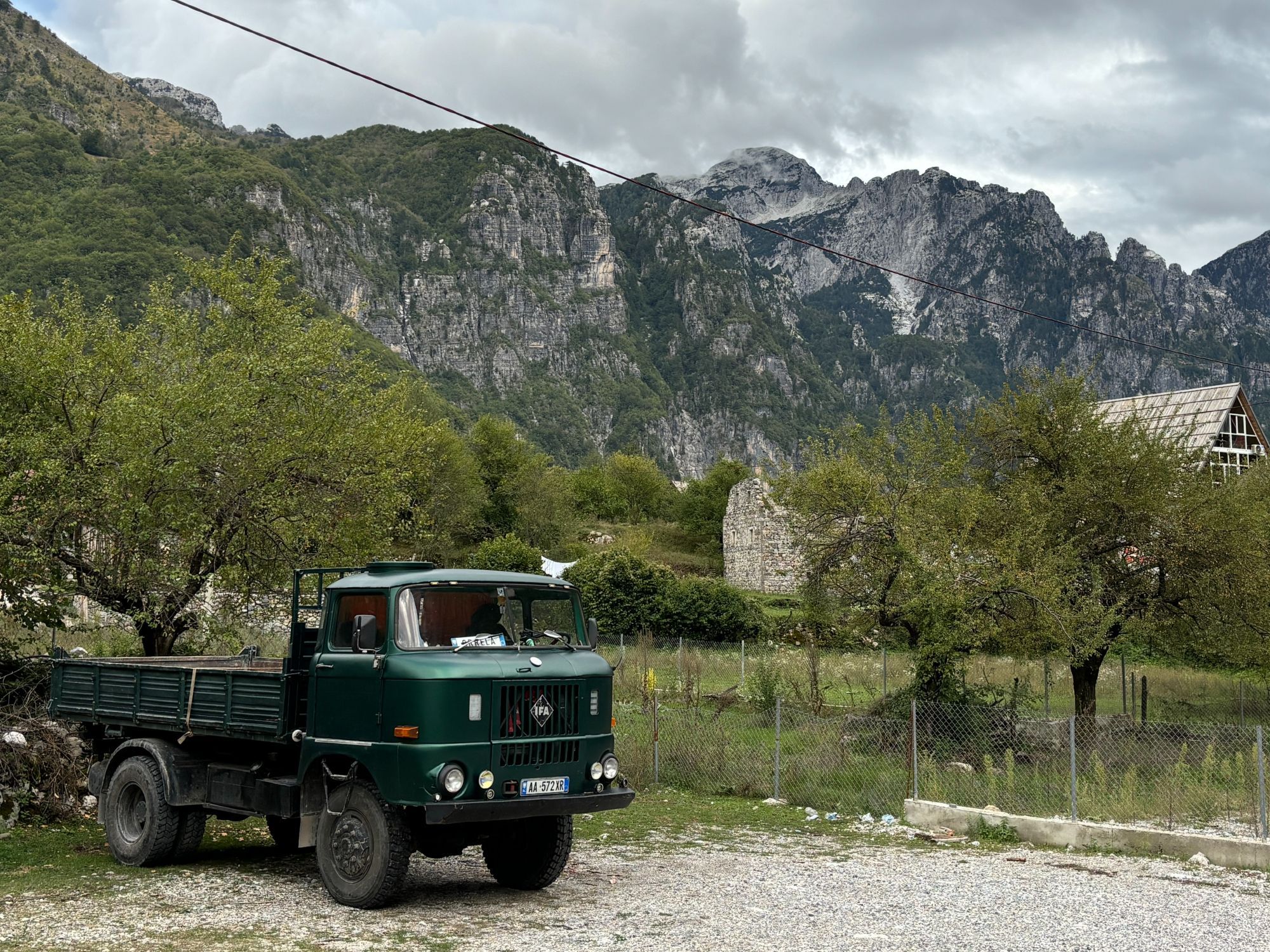 An East-German-made IFA commercial truck parked in a field in the Theth valley, Albania