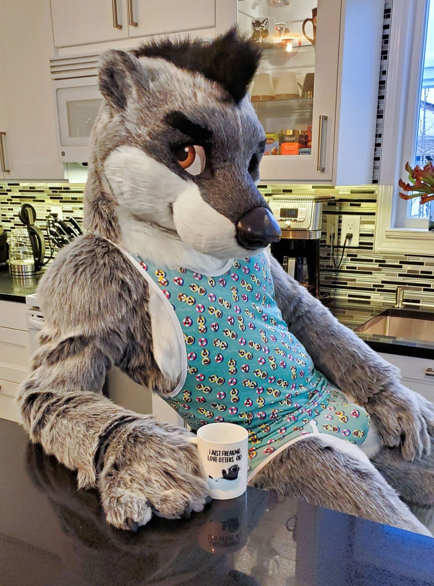 Uno kicking back in a matching green jock and tank top set from Rudderbutts