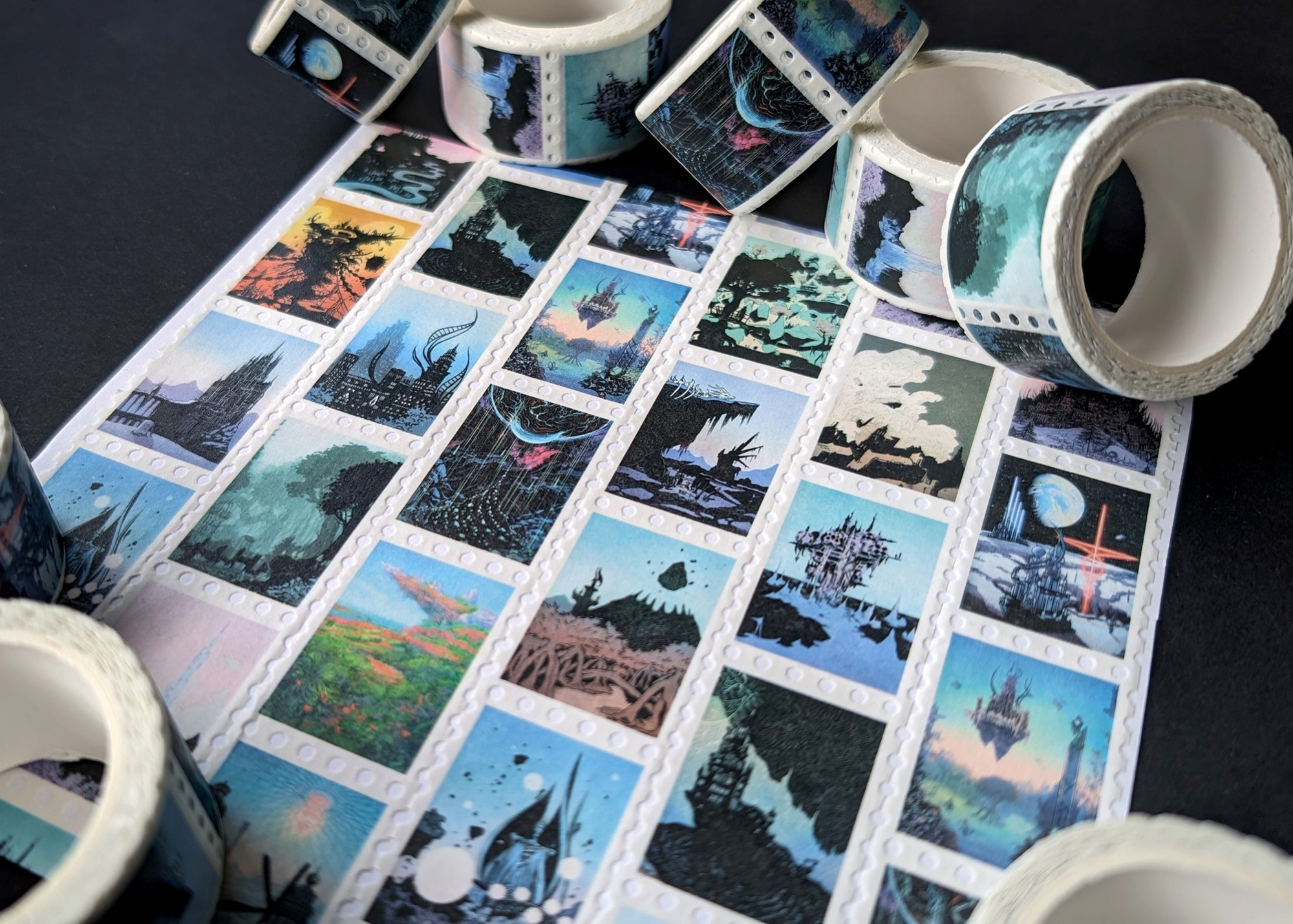 A photograph of rolls of stamp washi tape featuring illustrations of Final Fantasy locations on each stamp.