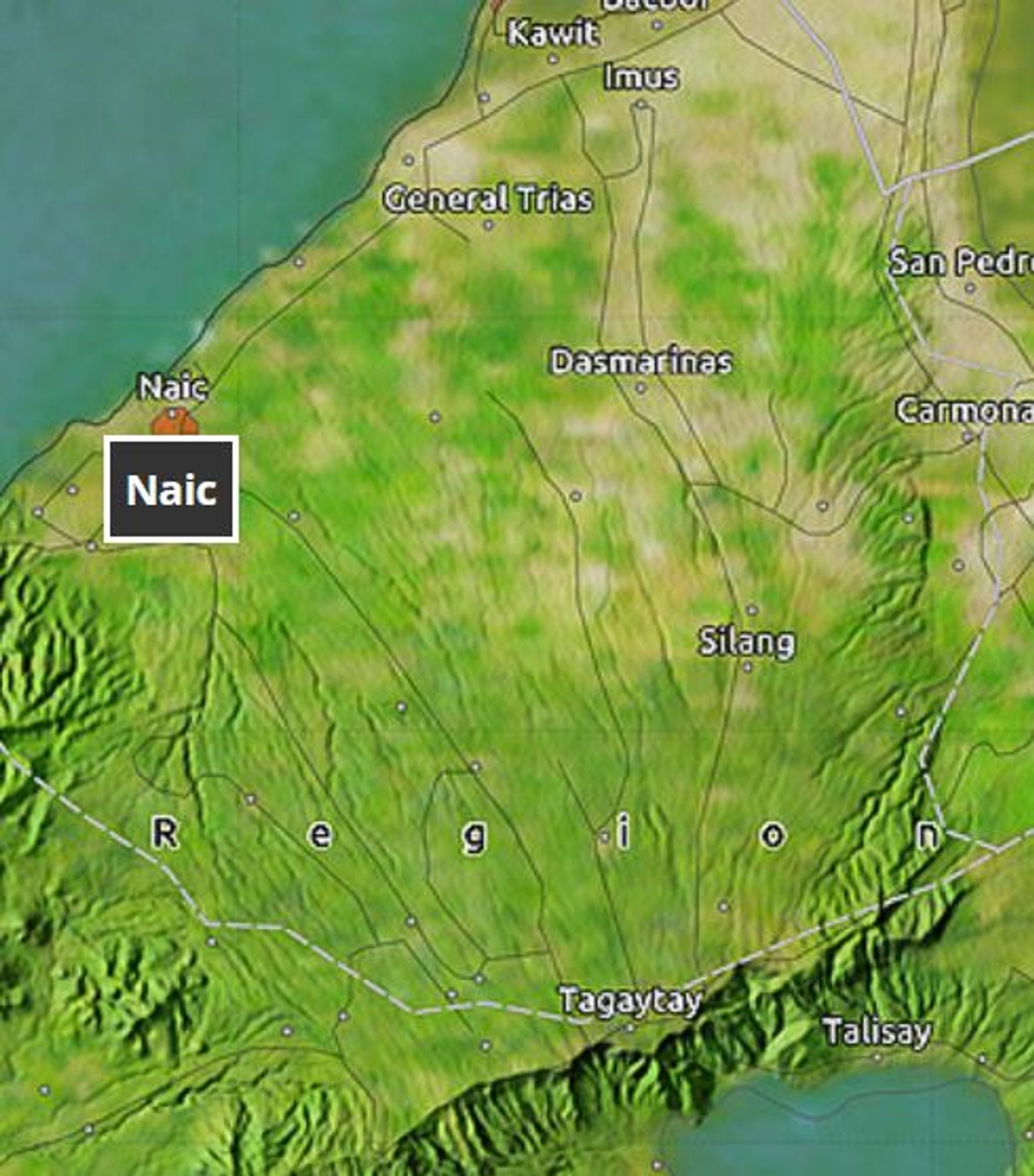 A topographical map of Cavite with Tagaytay on the ridge in the south, and Naic highlighted on the coast in the north. Many faint lines run up and down the whole province.