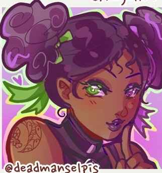 The image is an illustration of an animated character with a vibrant and colorful design. The character has purple hair styled in two large, puffy buns on either side of their head, with bright green strands accentuating the hair. They have large, expressive green eyes and purple lipstick, giving a striking contrast to their warm brown skin tone. The character is adorned with an intricate tattoo on their left shoulder, which features a floral or mandala pattern. The background is a gradient of light purple, adding to the vividness of the character’s appearance. The character's expression is playful, with one finger held up to their lips, suggesting a sense of mystery or cheekiness. In the bottom left corner is the text