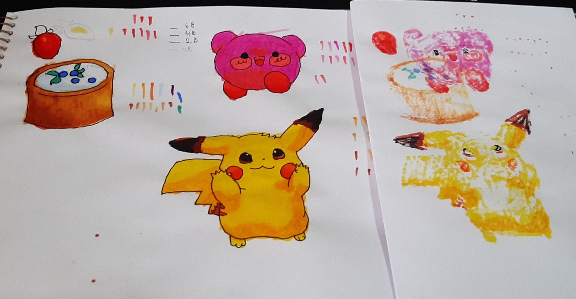 Página de caderno de desenho com desenhos de um morango, uma torta de blueberry, um Kirby (personagem que é basicamente uma bola rosa e feliz de sapatos) e um pikachu (rato elétrico amarelo com bochechas vermelhas). O pikachu está estendendo as mãos para quem olha a imagem, como se pedisse pra ser pegado no colo.