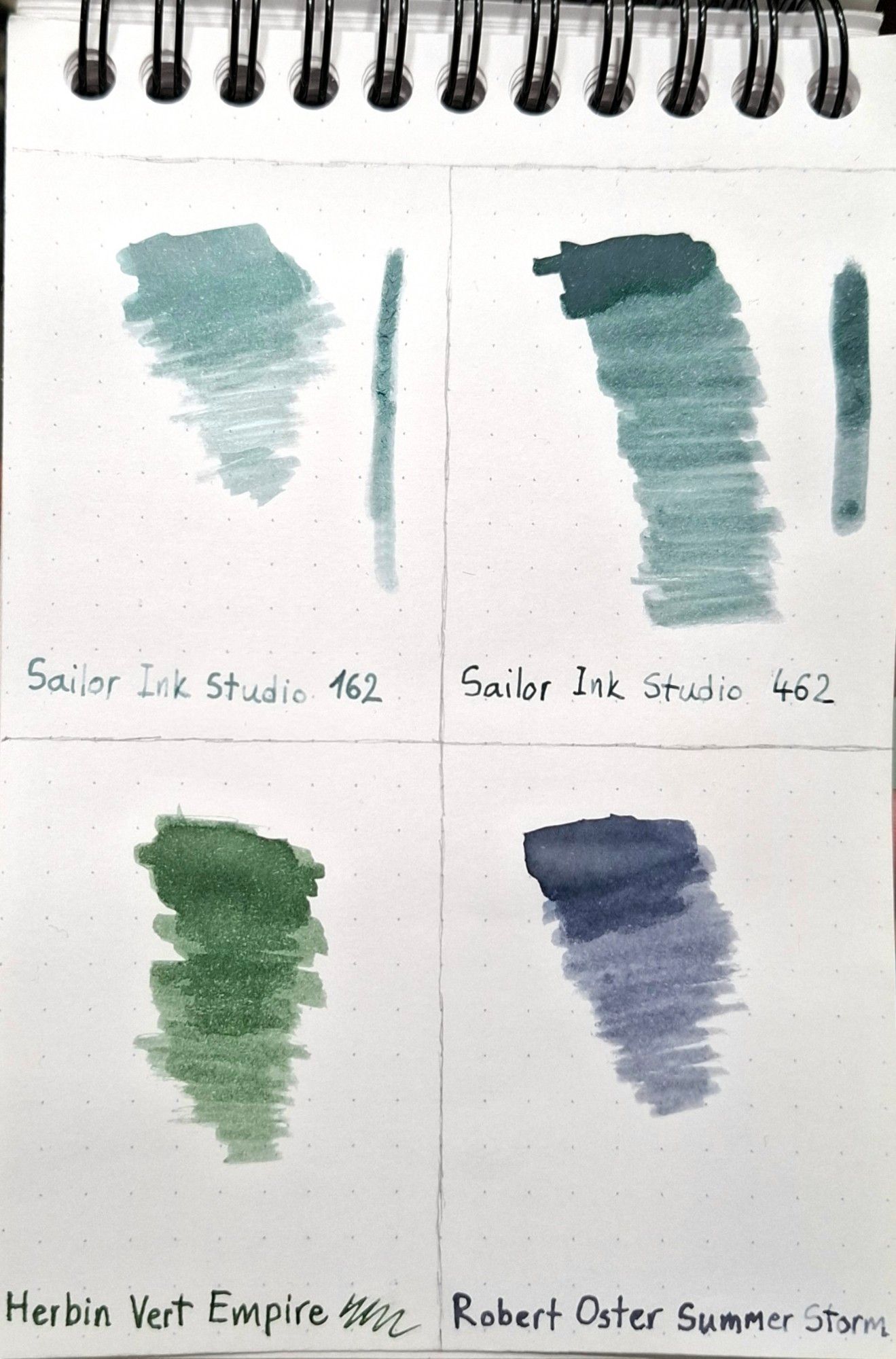 Sailor Ink Studio 162, a light grayish blue, edging towards turquoise. Sailor Ink Studio 462, a medium grayish teal. Herbin Vert Empire, a medium to dark green-gray, though the phone is making it look more saturated. Robert Oster Summer Storm, a strange grayish purplish bluish shade. Very ambiguous in its desaturation.