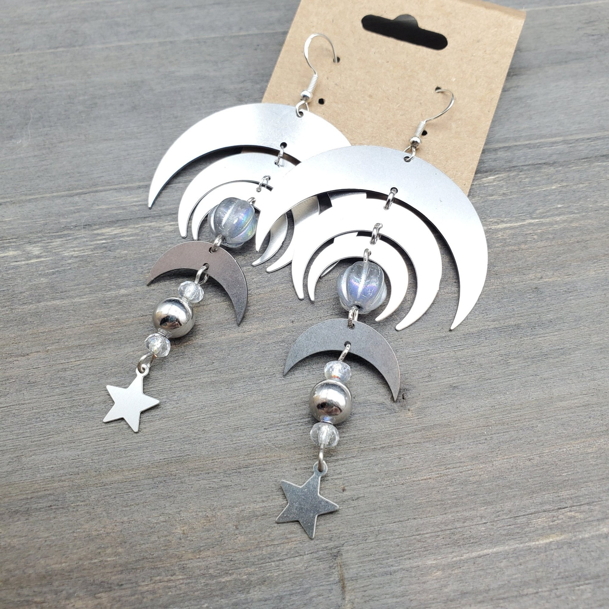 stainless steel cosmic style long earrings with inverted moons and stars