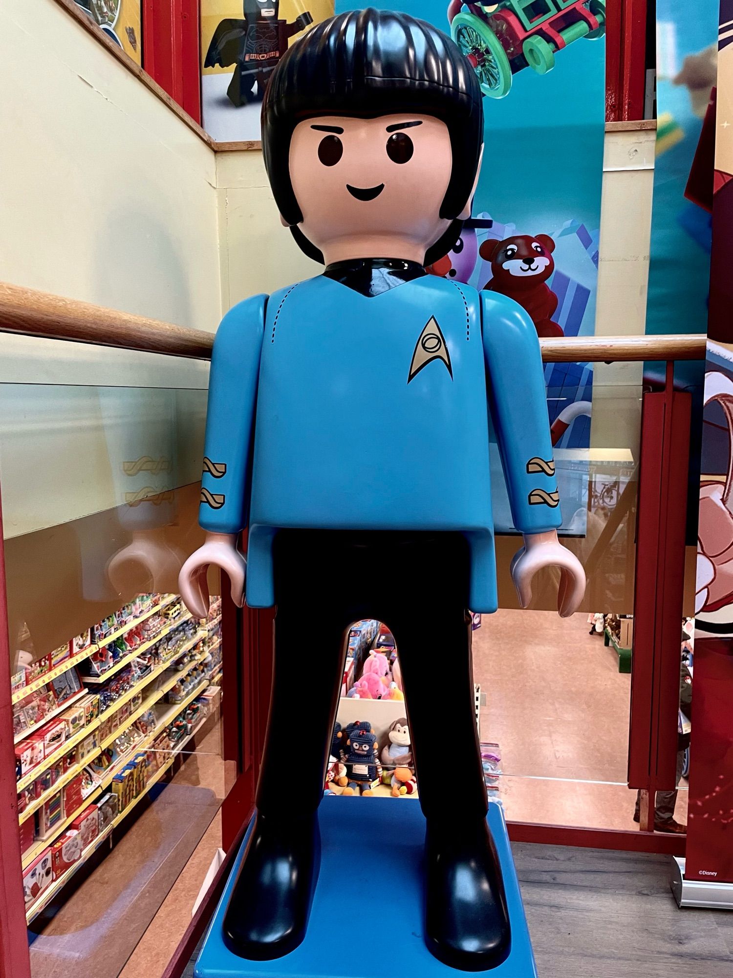 Almost lifesize Playmobil figure in a blue Star Trek uniform in a toy store.