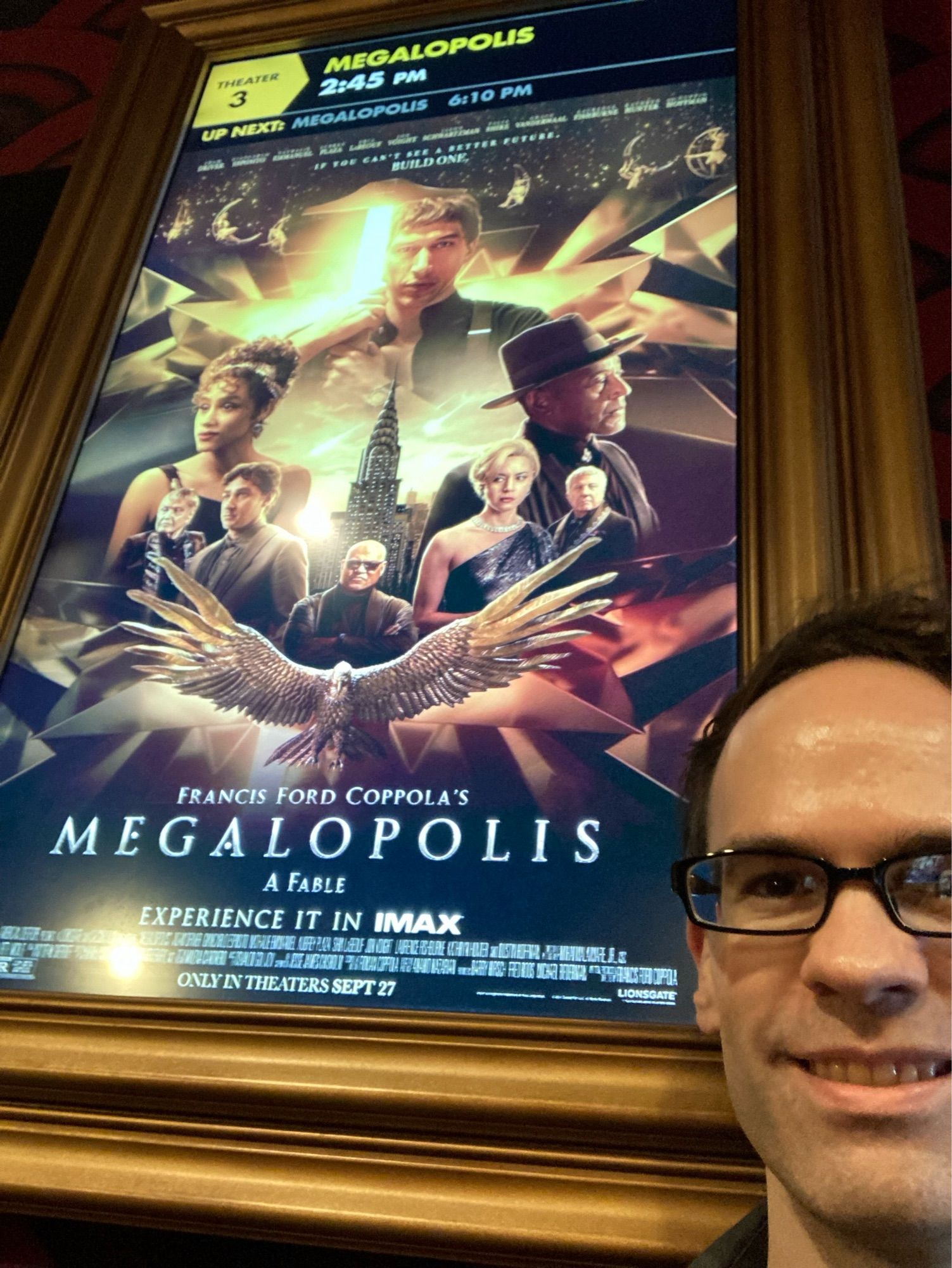 Selfie in front of the movie poster for Megalopolis at Alamo Drafthouse