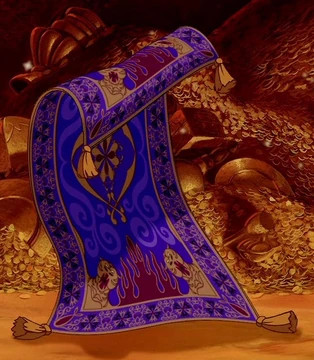 The Magic Carpet from Aladdin, blue and purple with gold accents. It has 4 yellow tassels, one on each corner, and is standing in a room full of gold and treasure