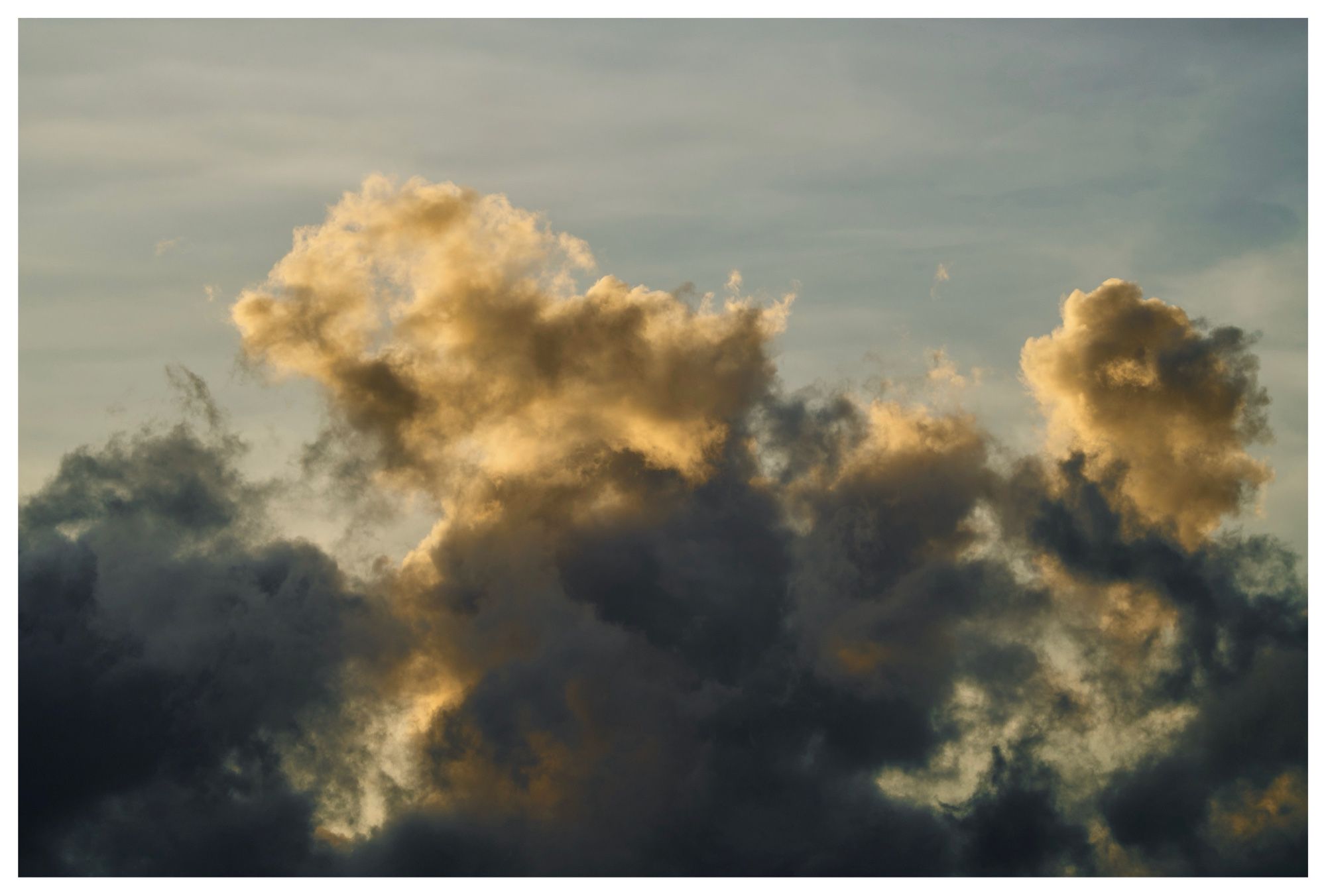 Clouds lit up by setting sun