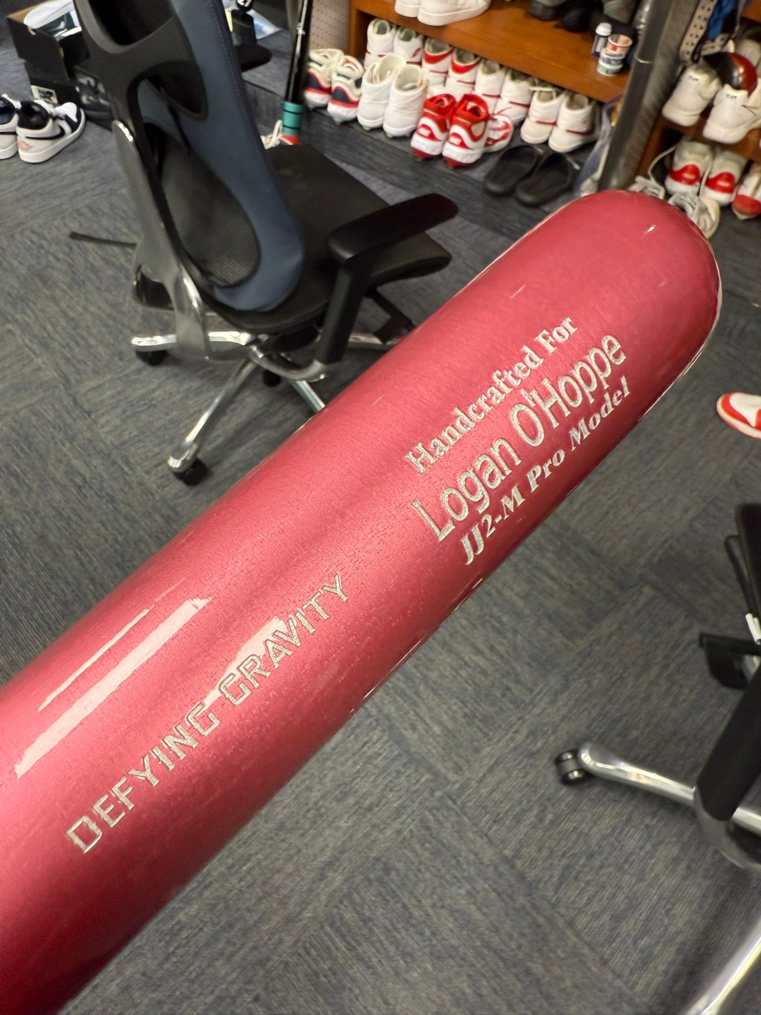 Logan O'Hoppe Wicked bat with "DEFYING GRAVITY"