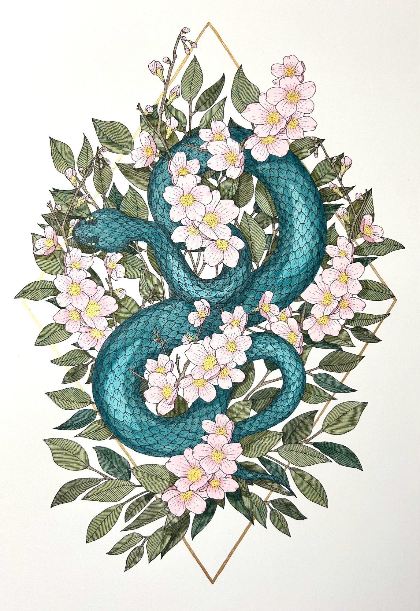 An illustration of a turquoise snake surrounded by cherry blossom and foliage with a gold diamond shaped outline behind.