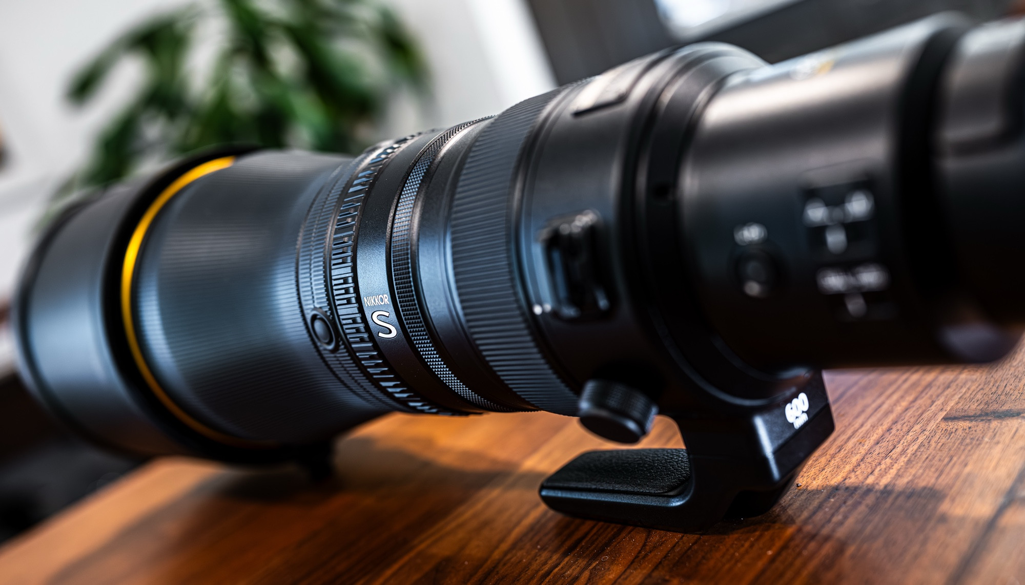 A more artistic close-up shot of the lens itself, emphasizing the “NIKKOR S” badging on the side.