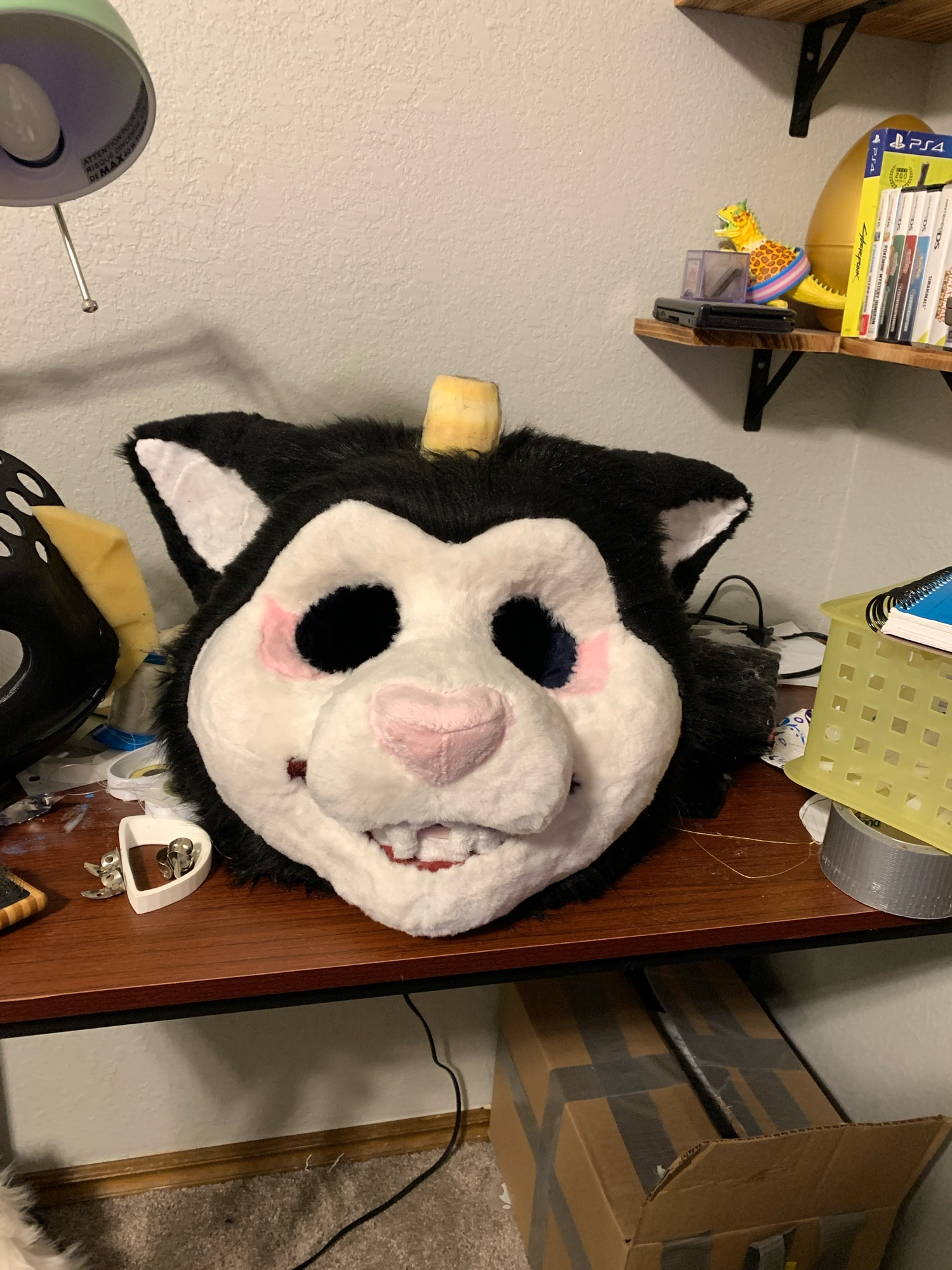 Black and white faced kitty cat fursuit head with pink eye bags